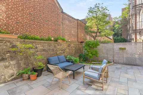 a view of a chairs and table in the patio