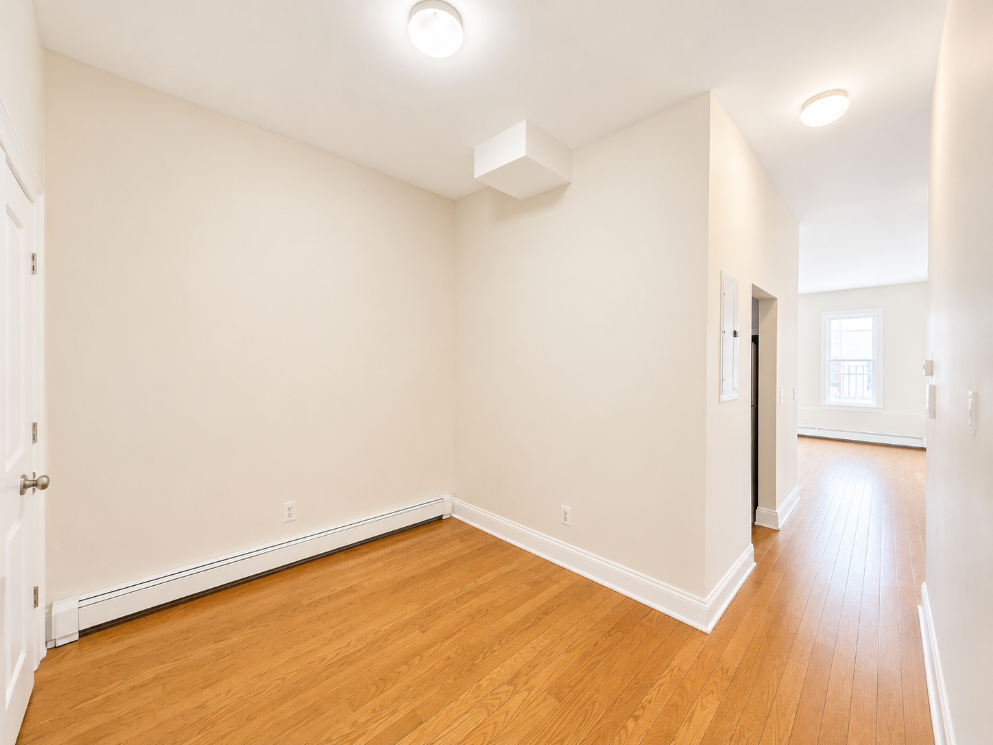 37-15 Broadway, Unit 2 Queens, NY 11103 - Photo 5 of 7 a view of empty room with wooden floor