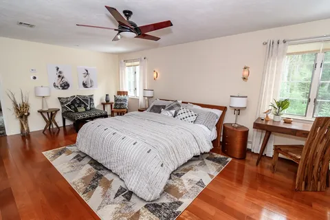 a room with furniture and wooden floor