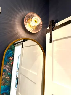 a view of bathroom with a small space and a mirror