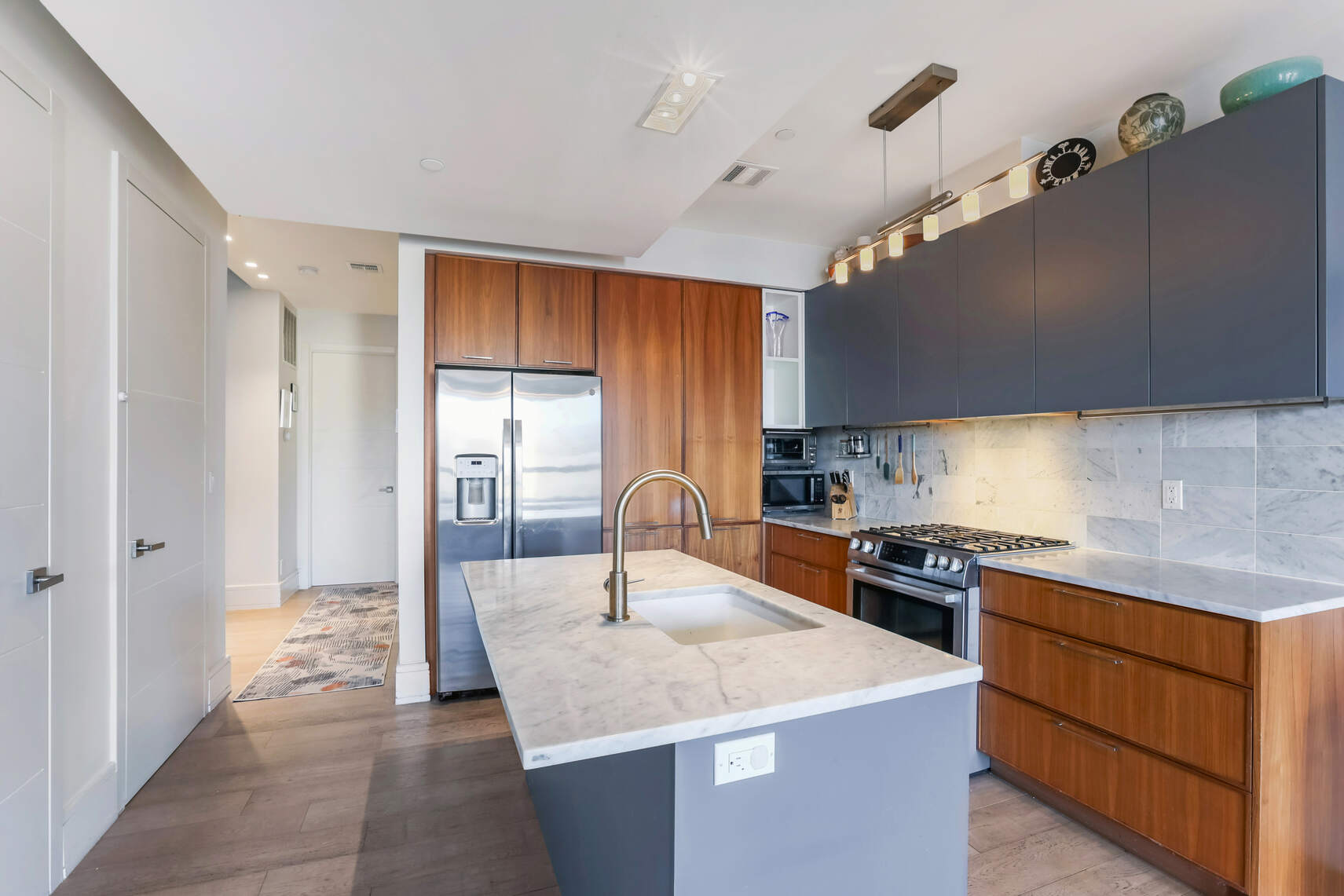 288 19th Street, Unit 3 Brooklyn, NY 11215 - Photo 4 of 26 a kitchen with granite countertop cabinets stainless steel appliances and a counter top space