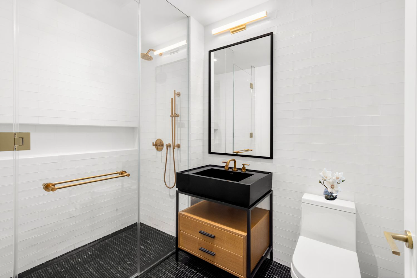 30 East 29th Street, Unit 36D Manhattan, NY 10016 - Photo 7 of 13 a bathroom with a sink toilet and mirror