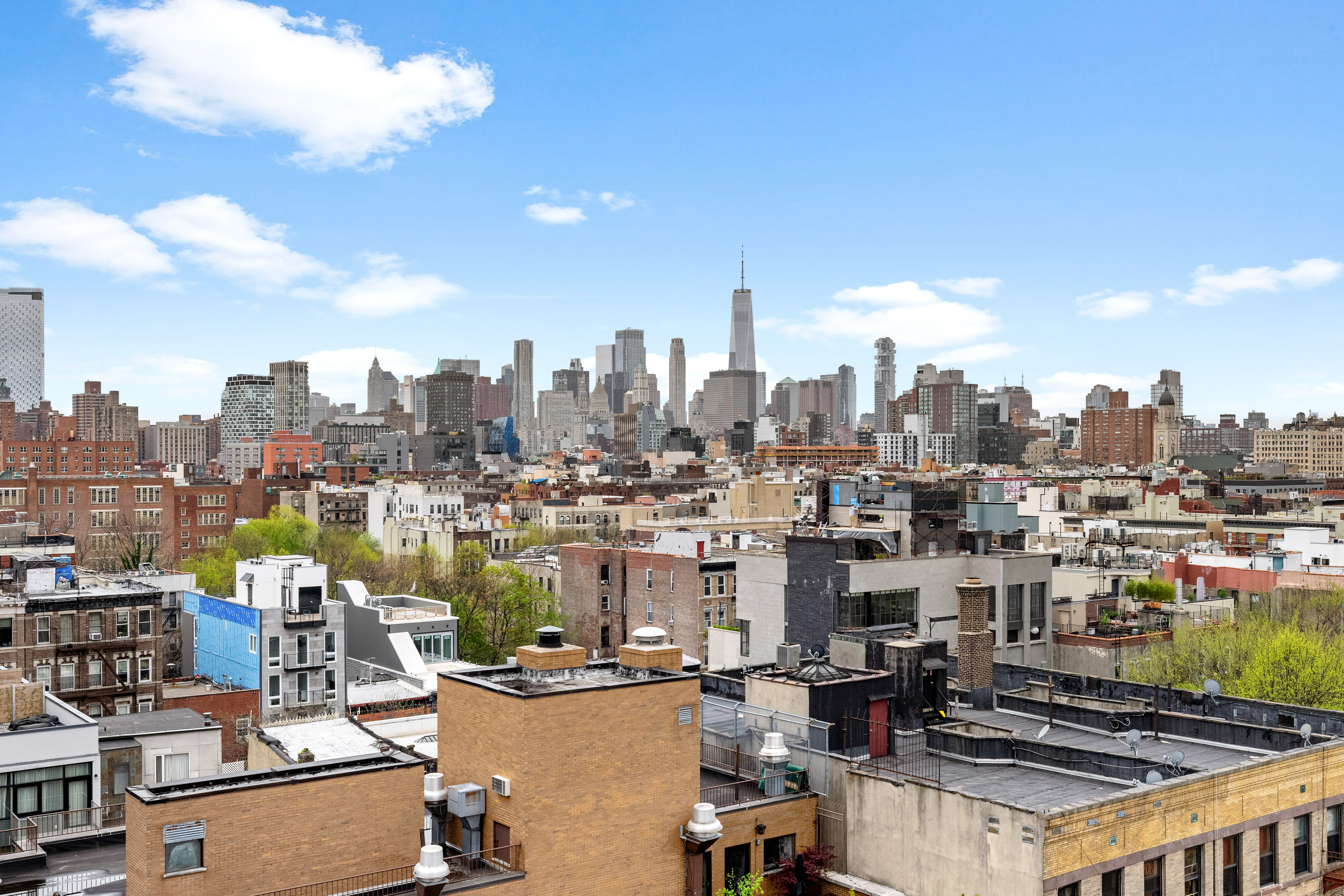 399 East 8th Street, Unit 1A Manhattan, NY 10009 - Photo 11 of 13 a view of a city with tall buildings