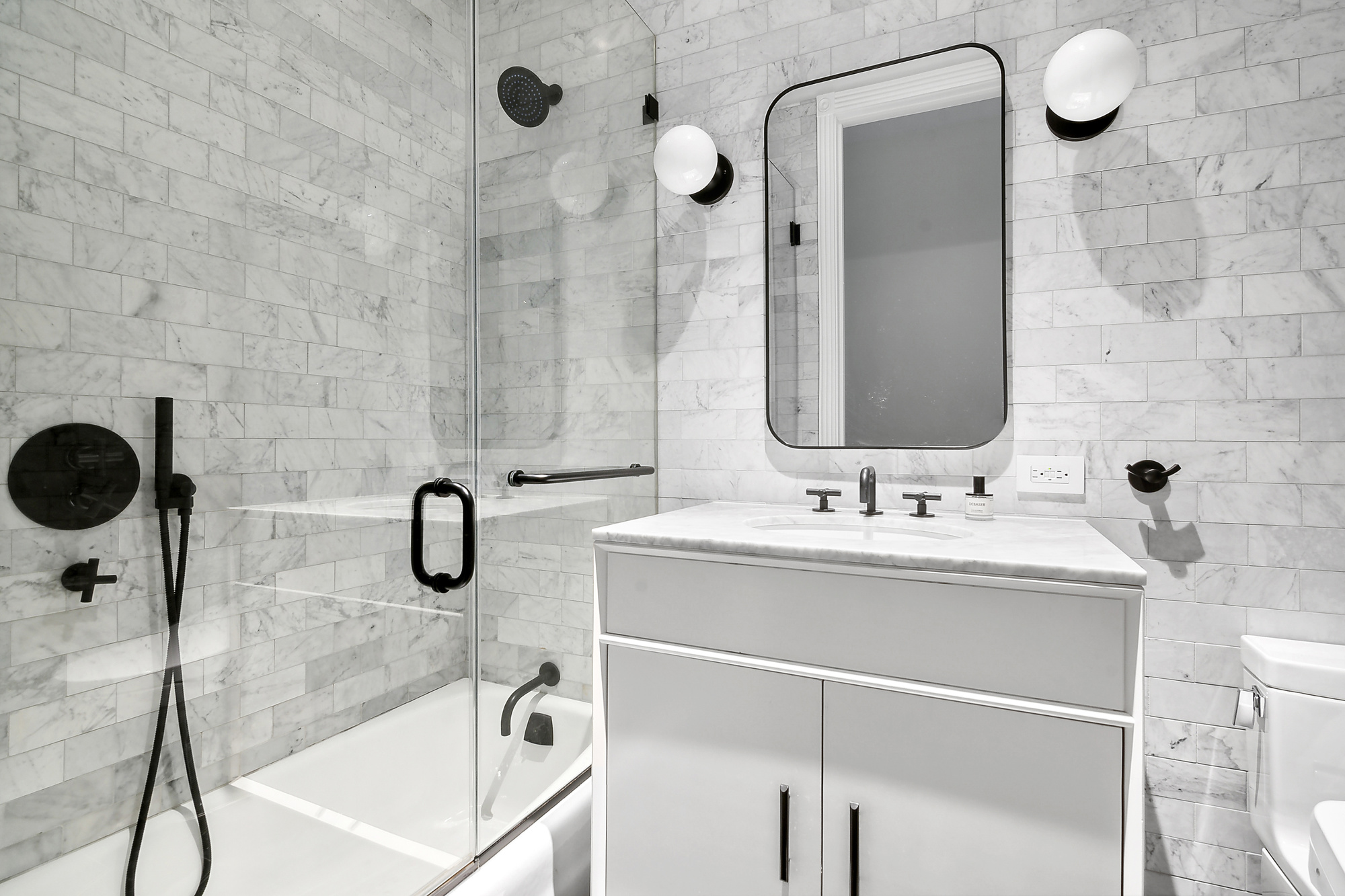 374 14th Street Brooklyn, NY 11215 - Photo 6 of 11 a bathroom with a sink and mirror