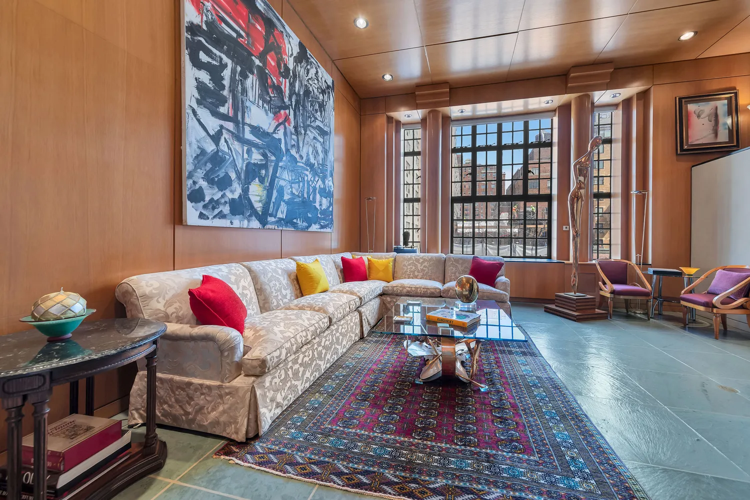 a living room with furniture rug and window