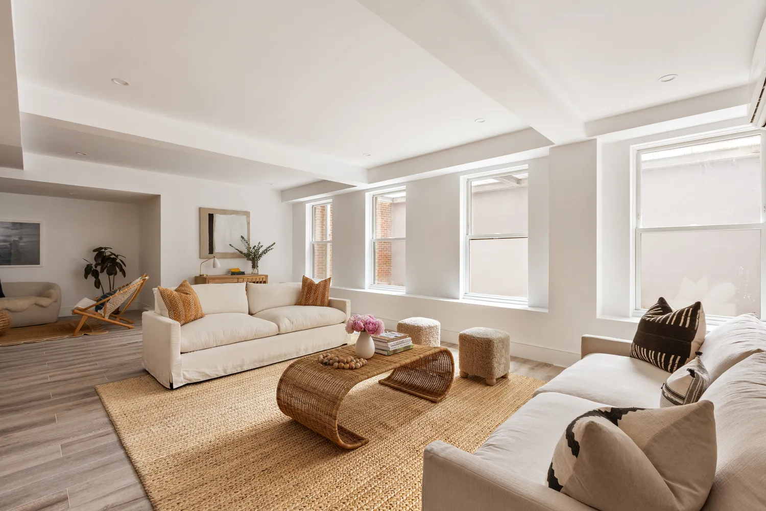 a living room with furniture window and a couch