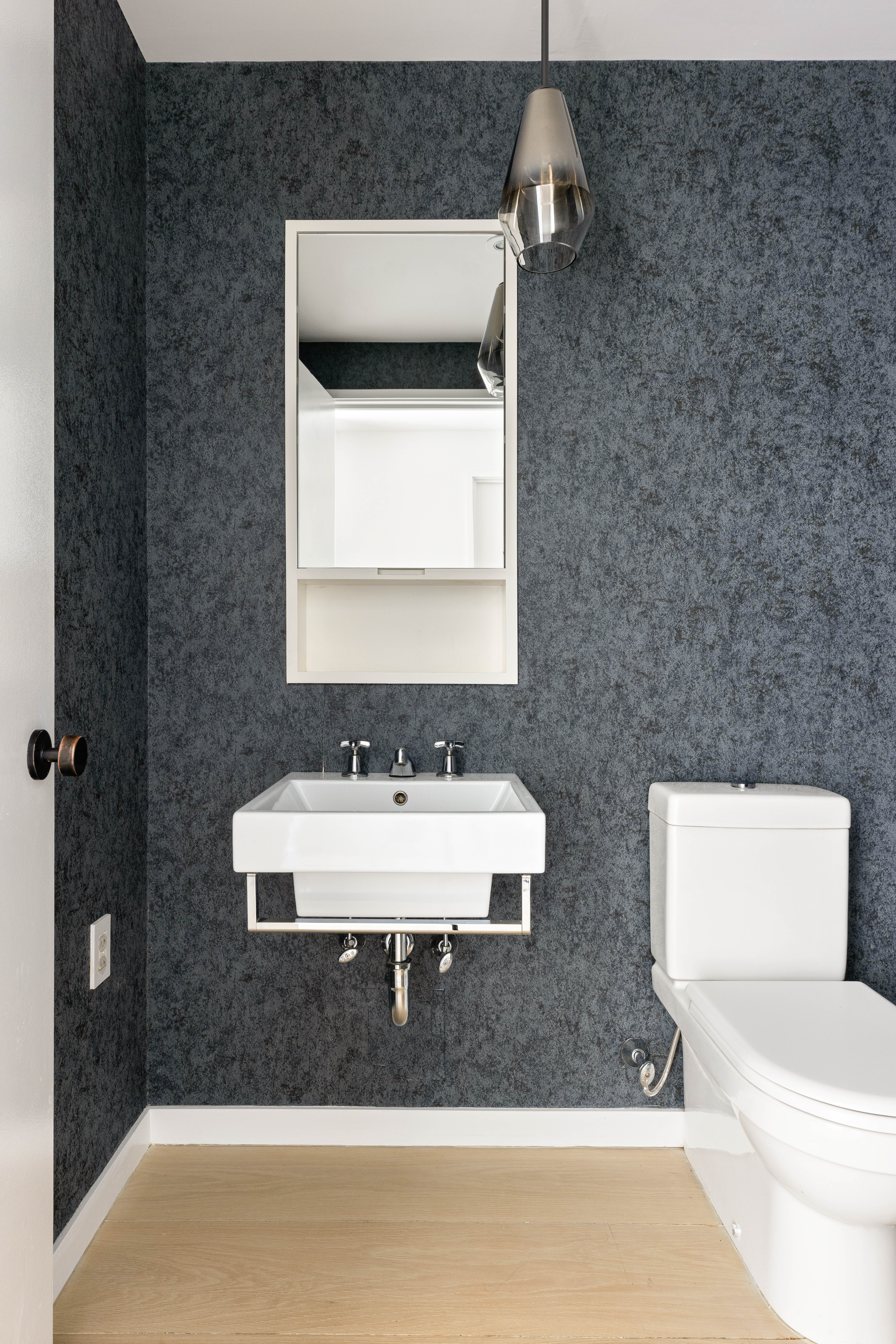 456 West 19th Street, Unit 2/3F Manhattan, NY 10011 - Photo 12 of 14 a bathroom with a toilet sink and mirror