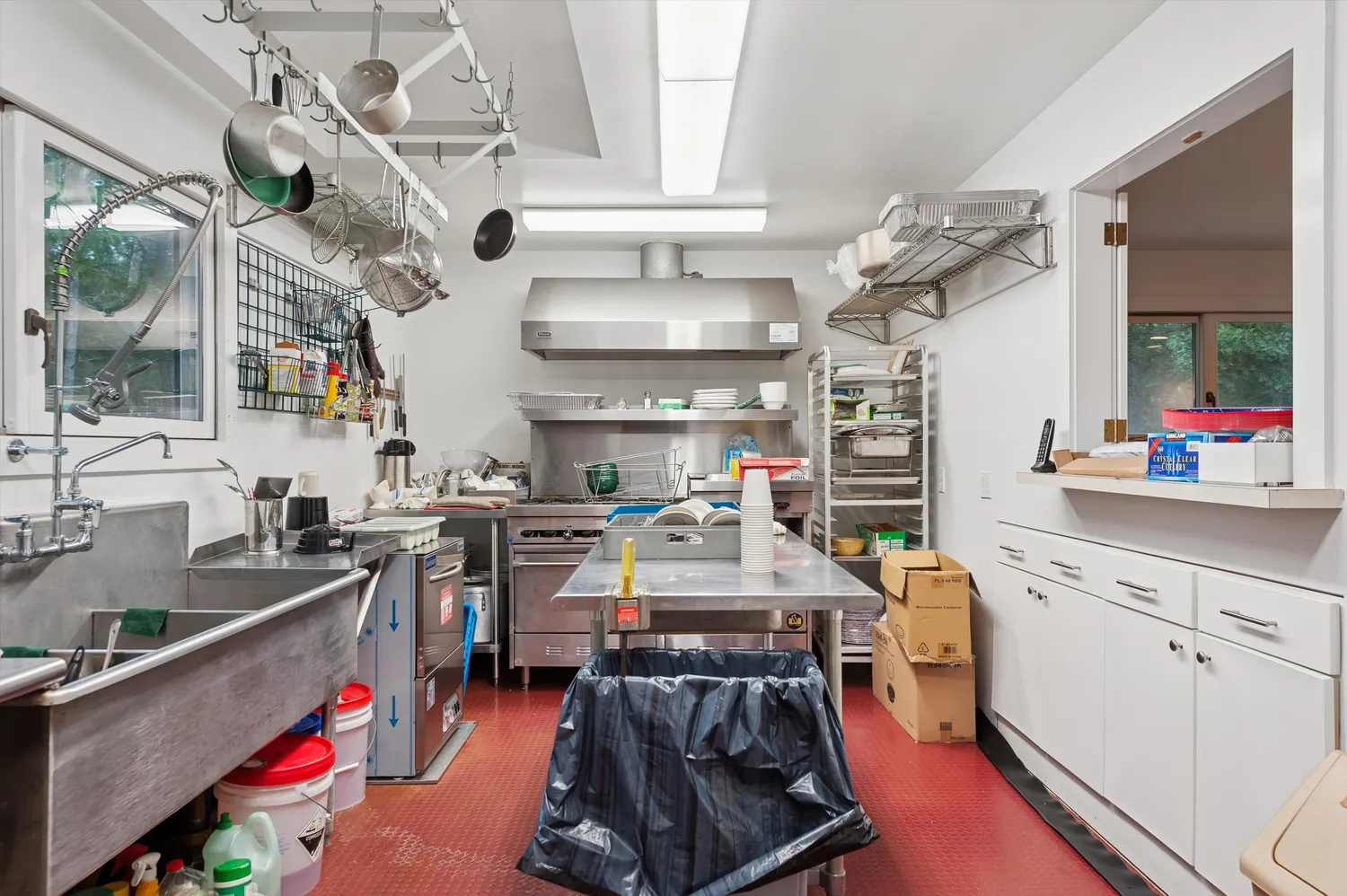 a room with lots of wooden furniture and a chandelier
