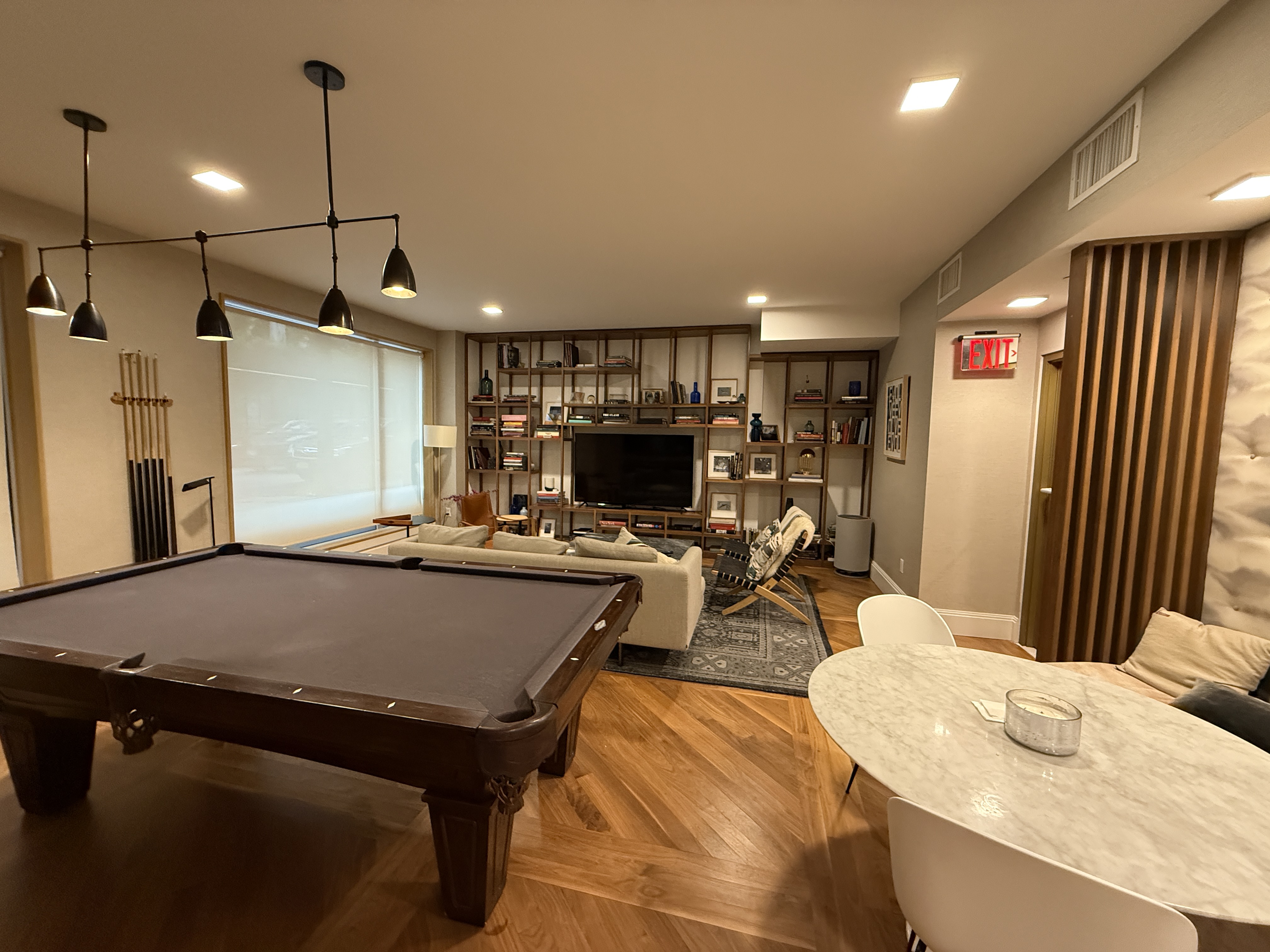 610 Warren Street, Unit 5F Brooklyn, NY 11217 - Photo 13 of 14 a living room with stainless steel appliances kitchen island granite countertop furniture and a flat screen tv