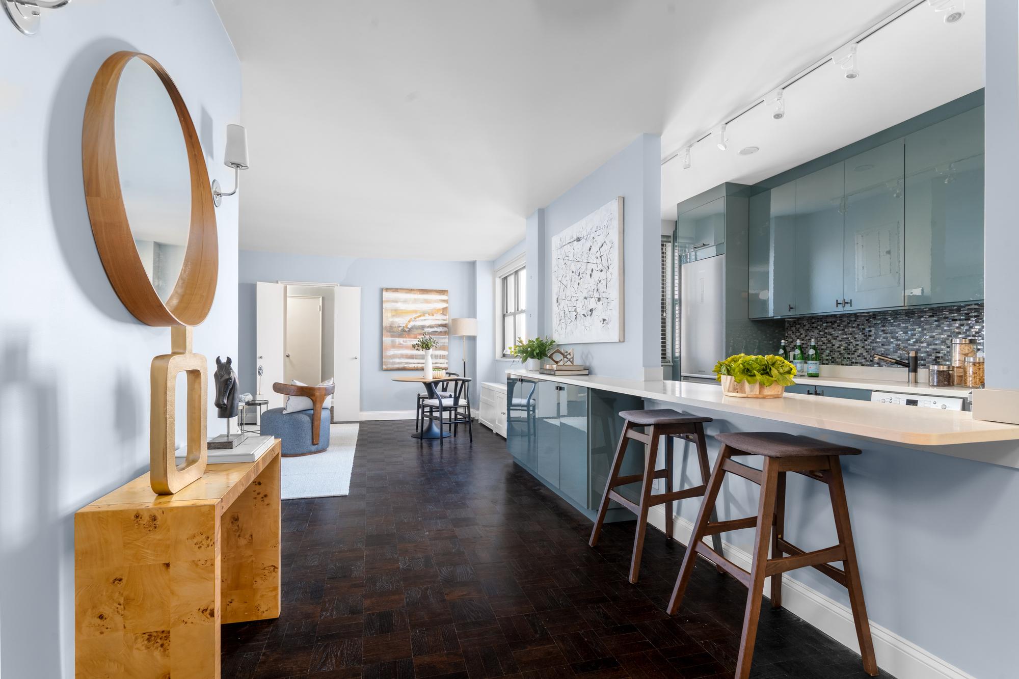 315 East 72nd Street, Unit 16A Manhattan, NY 10021 - Photo 2 of 12 a dining room with furniture and wooden floor