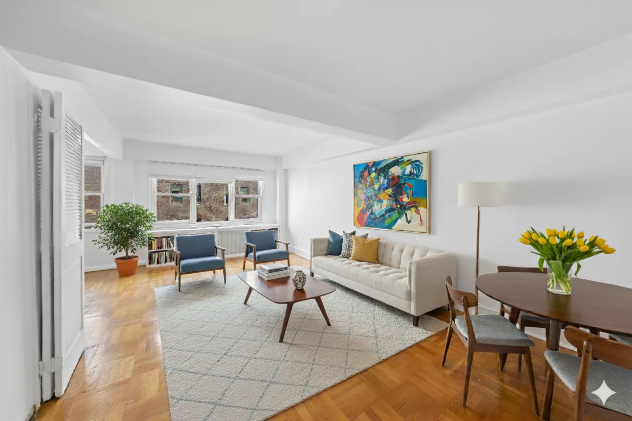 a living room with furniture and a potted plant