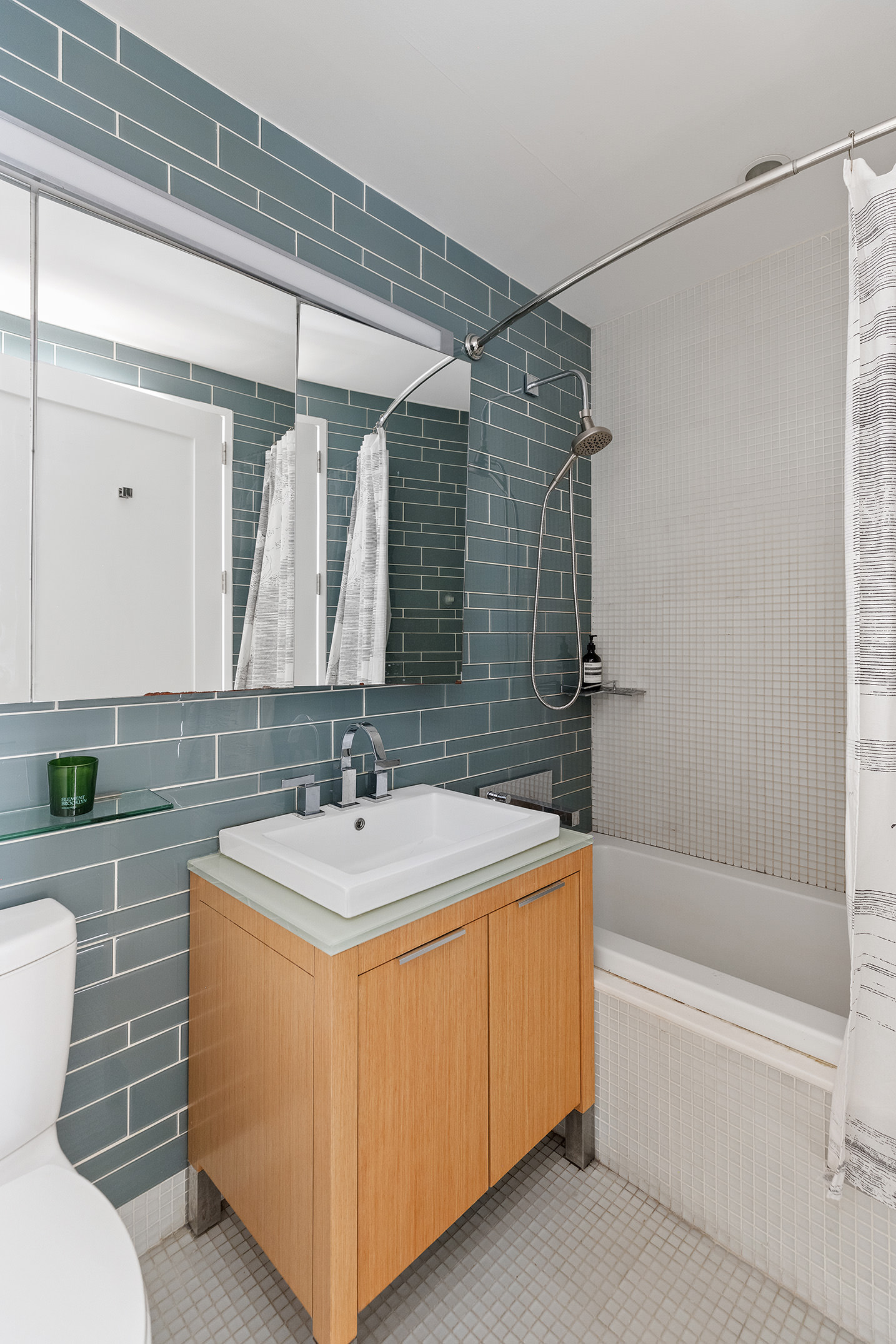 22 North 6th Street, Unit 4P Brooklyn, NY 11249 - Photo 6 of 12 a bathroom with a sink and mirror with bathtub