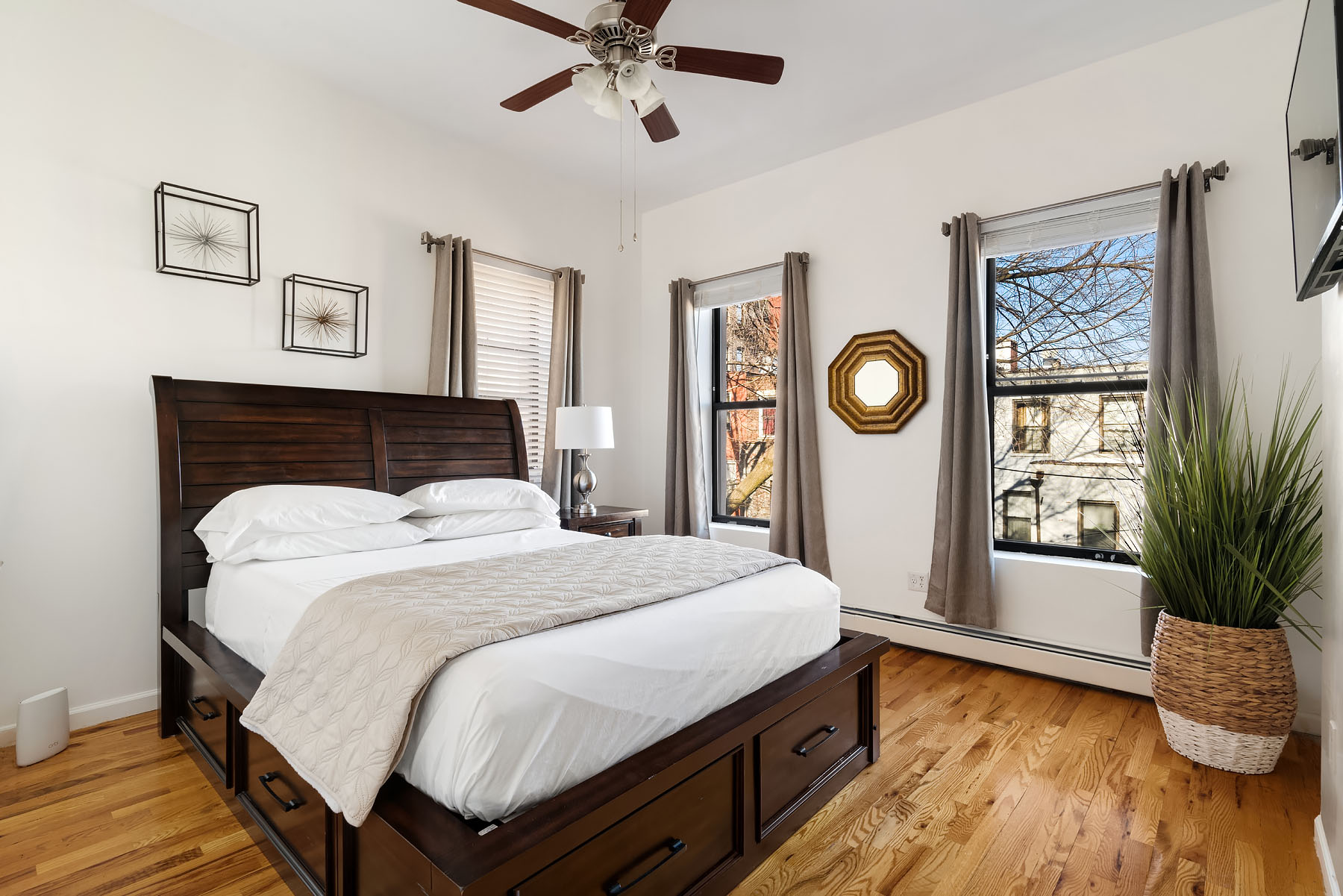 469 West 140th Street, Unit 2 Manhattan, NY 10031 - Photo 8 of 8 a bedroom with a large bed and a window