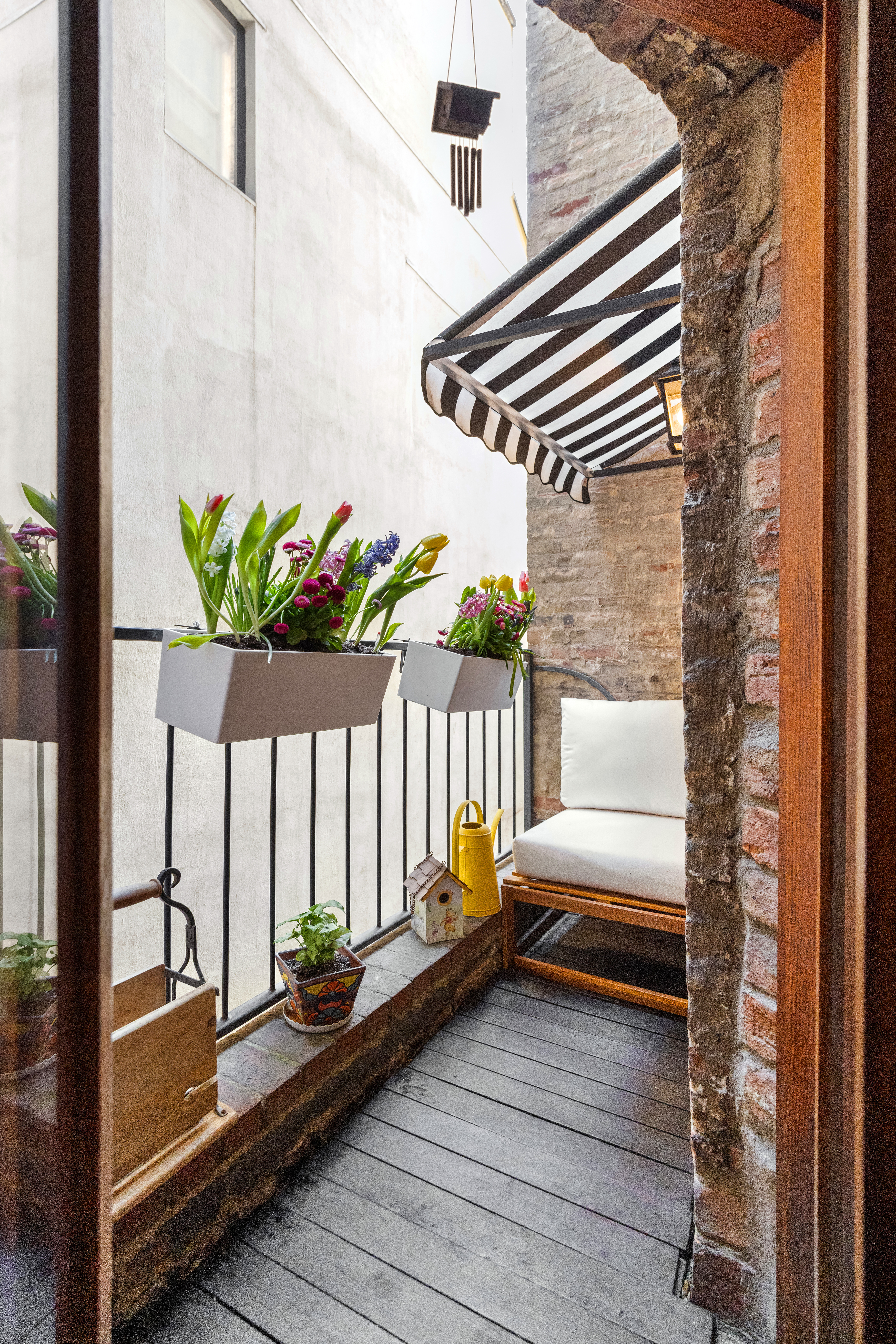 237 West 11th Street, Unit 2B Manhattan, NY 10014 - Photo 12 of 13 a view of a balcony with chairs and a potted plant