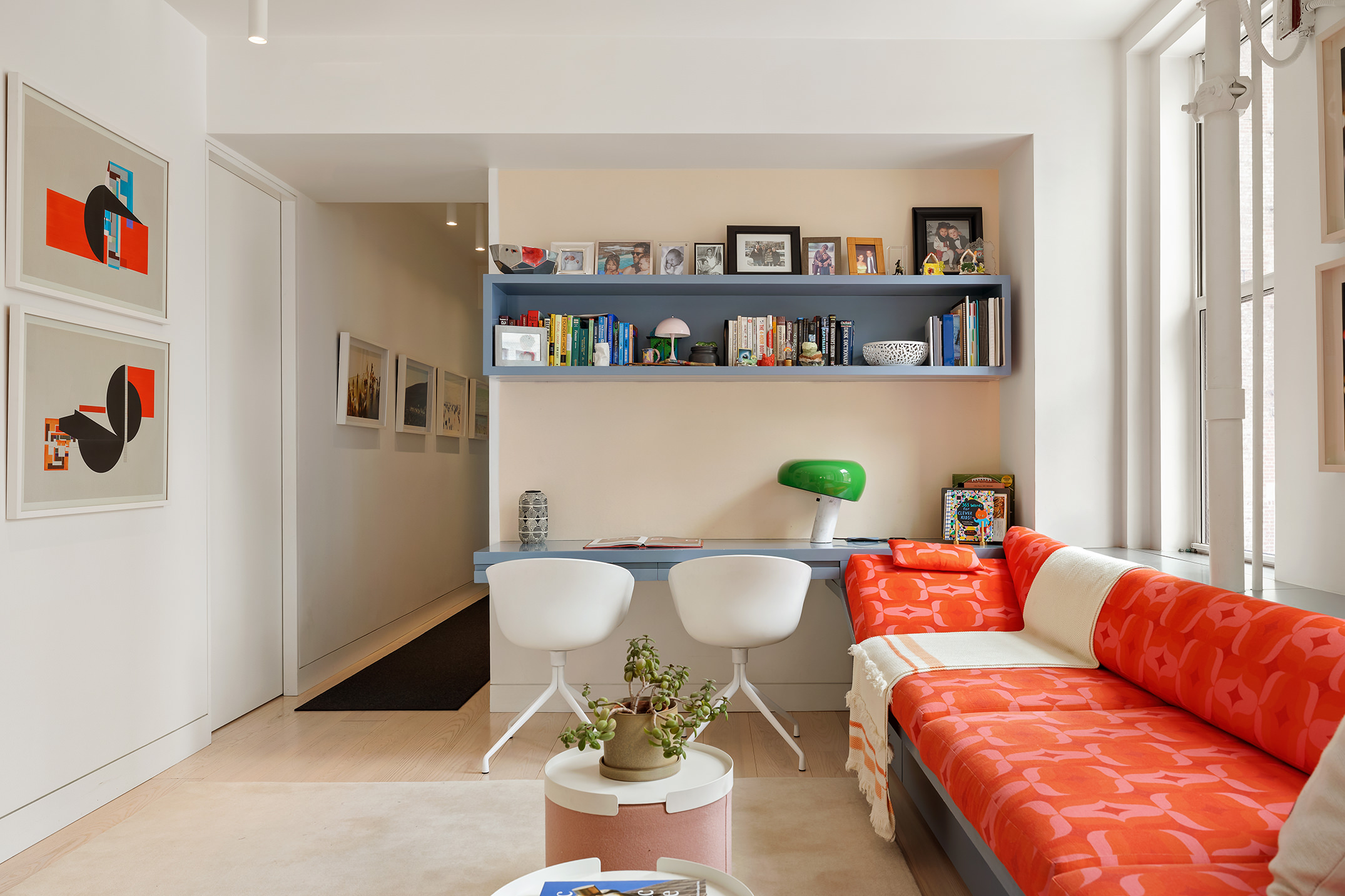 24 West 30th Street, Unit 7 Manhattan, NY 10001 - Photo 3 of 13 a living room with furniture and a book shelf
