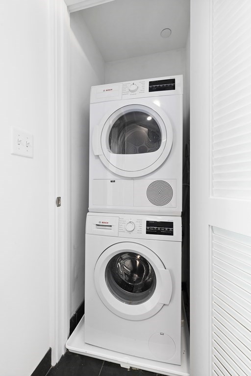 319 A Street, Unit 211 Boston, MA 02210 - Photo 12 of 24 a utility room with dryer and washer