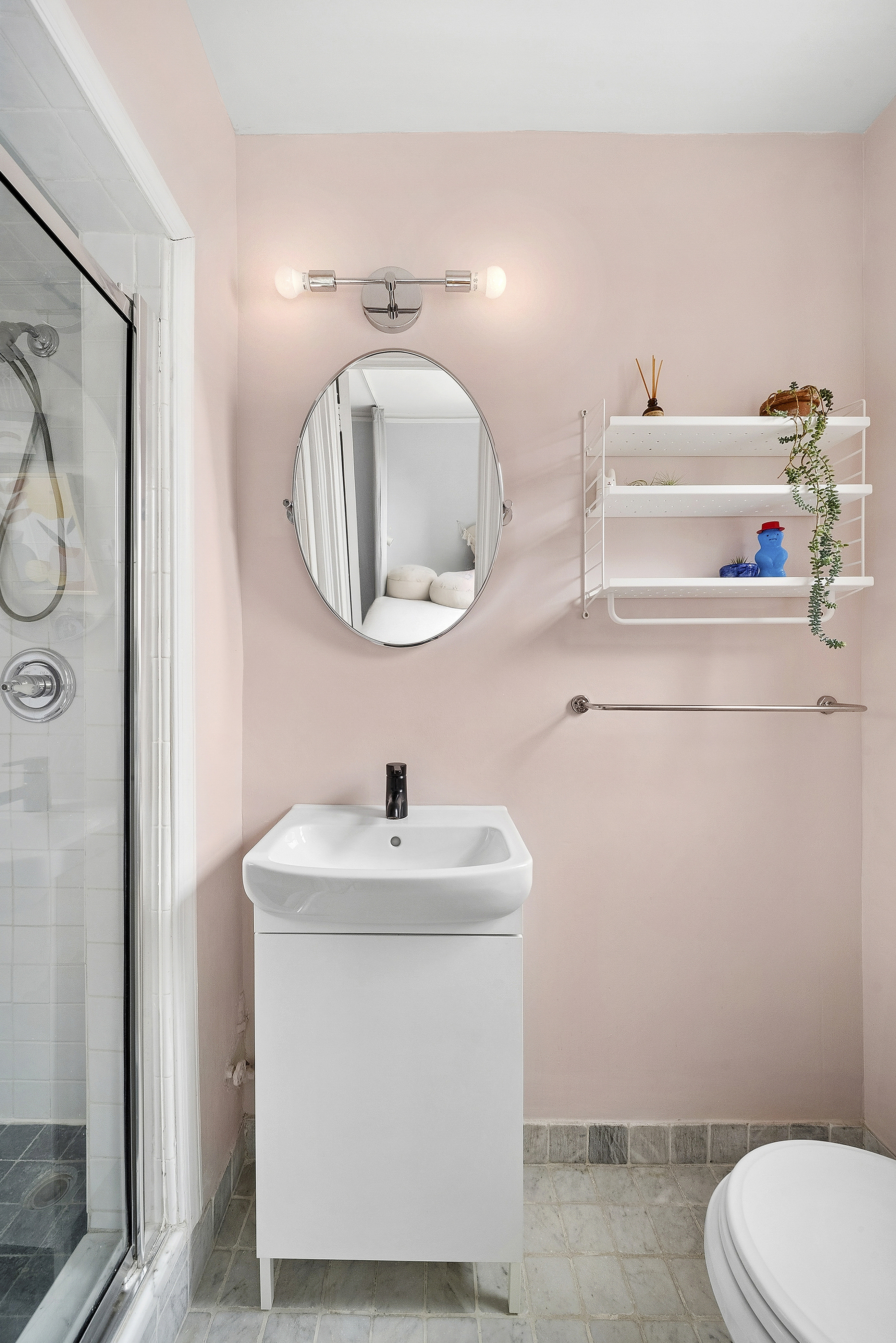 474 West 238th Street, Unit 2E Bronx, NY 10463 - Photo 9 of 13 a bathroom with a sink toilet and mirror