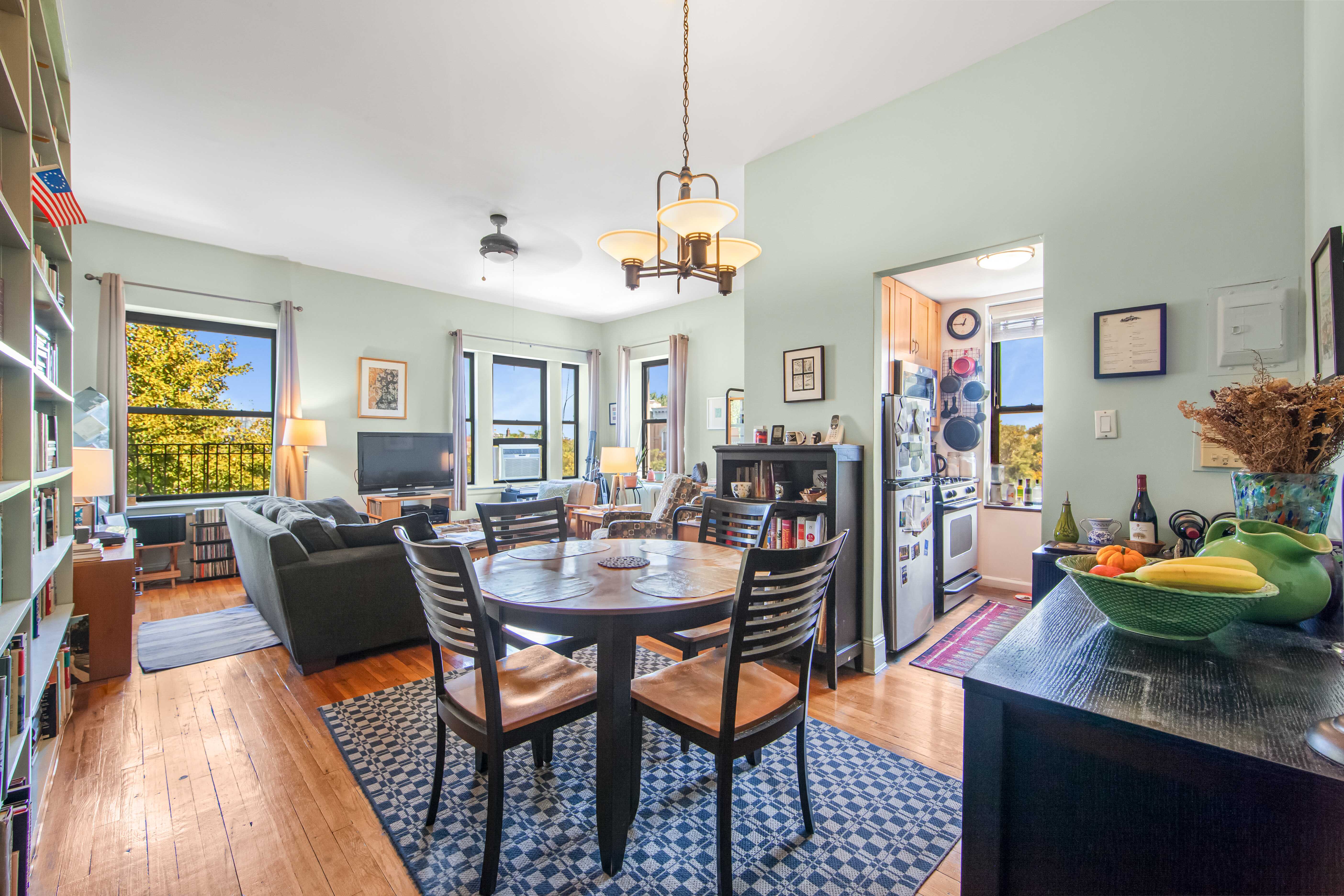 254 Park Place, Unit 4B Brooklyn, NY 11238 - Photo 3 of 12 a view of a dining room with furniture and a chandelier