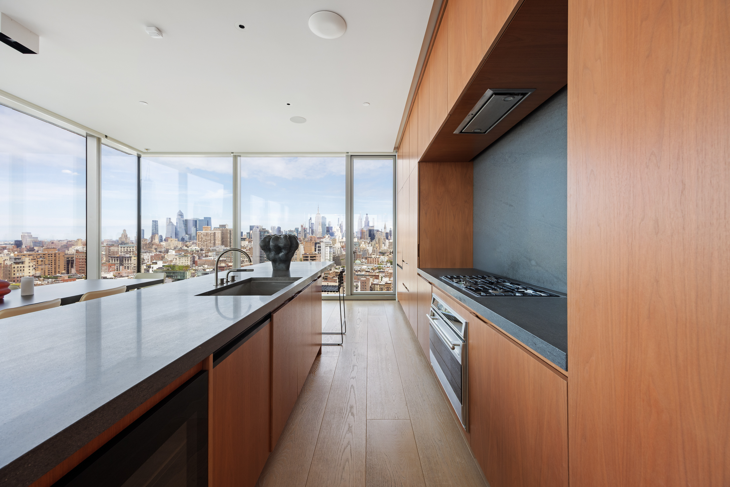 215 Chrystie Street, Unit 29W Manhattan, NY 10002 - Photo 12 of 24 a open kitchen with a large window