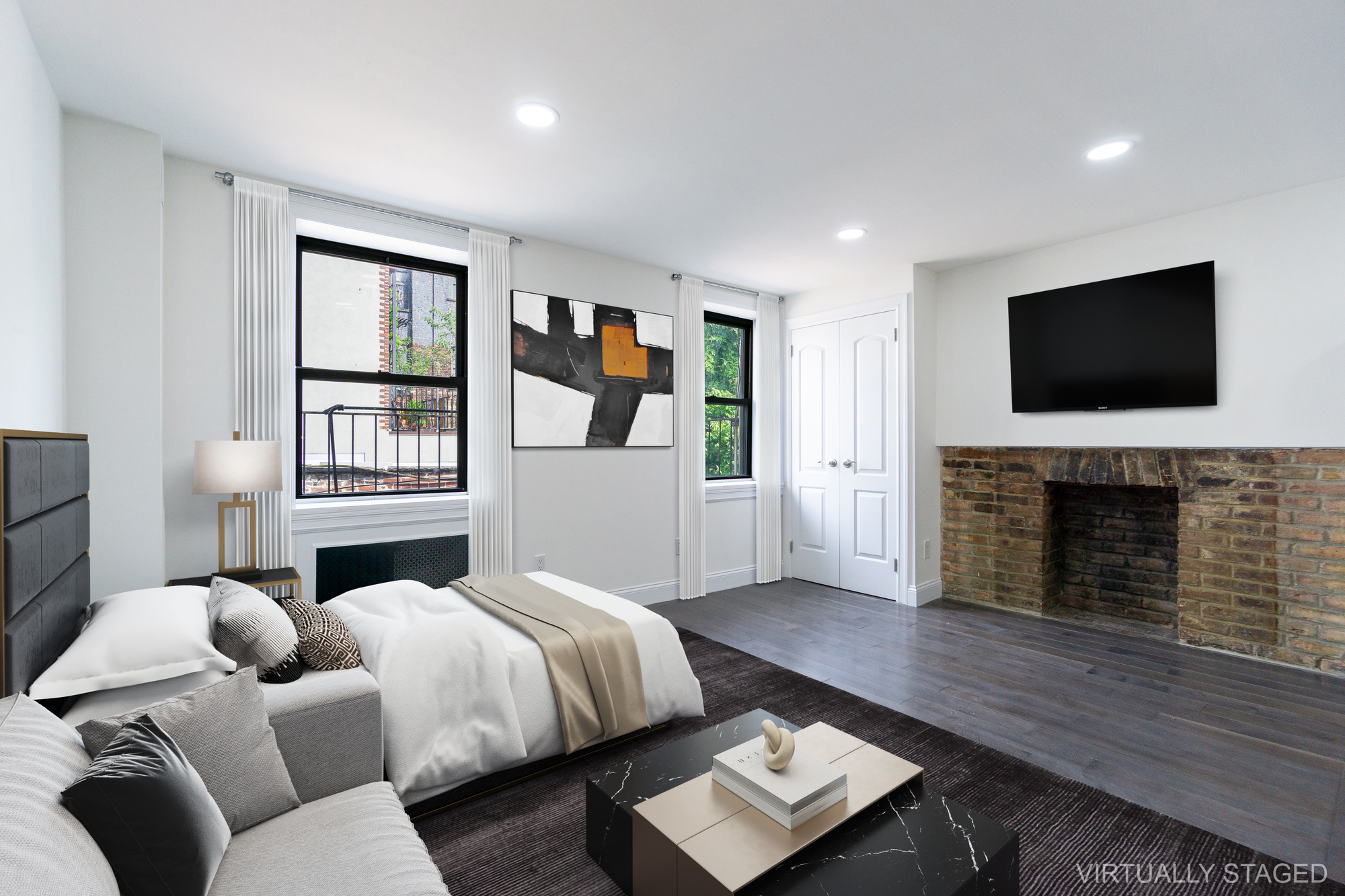 a bedroom with a bed and a flat screen tv