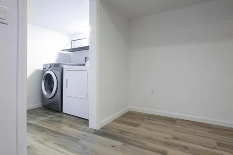 a view of a storage & utility room with washer and dryer