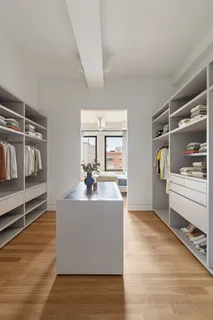a view of living room kitchen with furniture and wooden floor