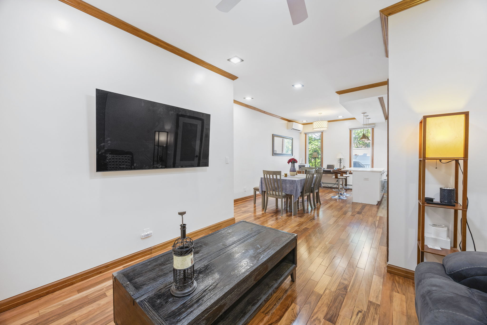 25-69 46th Street Queens, NY 11103 - Photo 18 of 33 a living room with furniture and a flat screen tv