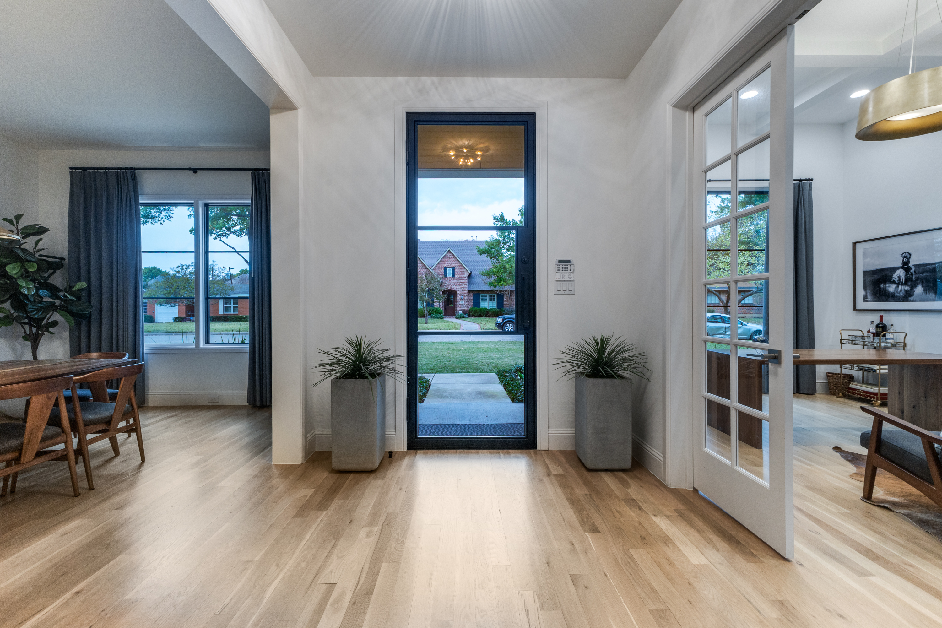 4042 Dunhaven Road Dallas, TX 75220 - Photo 2 of 34 a living room with furniture and a wooden floor