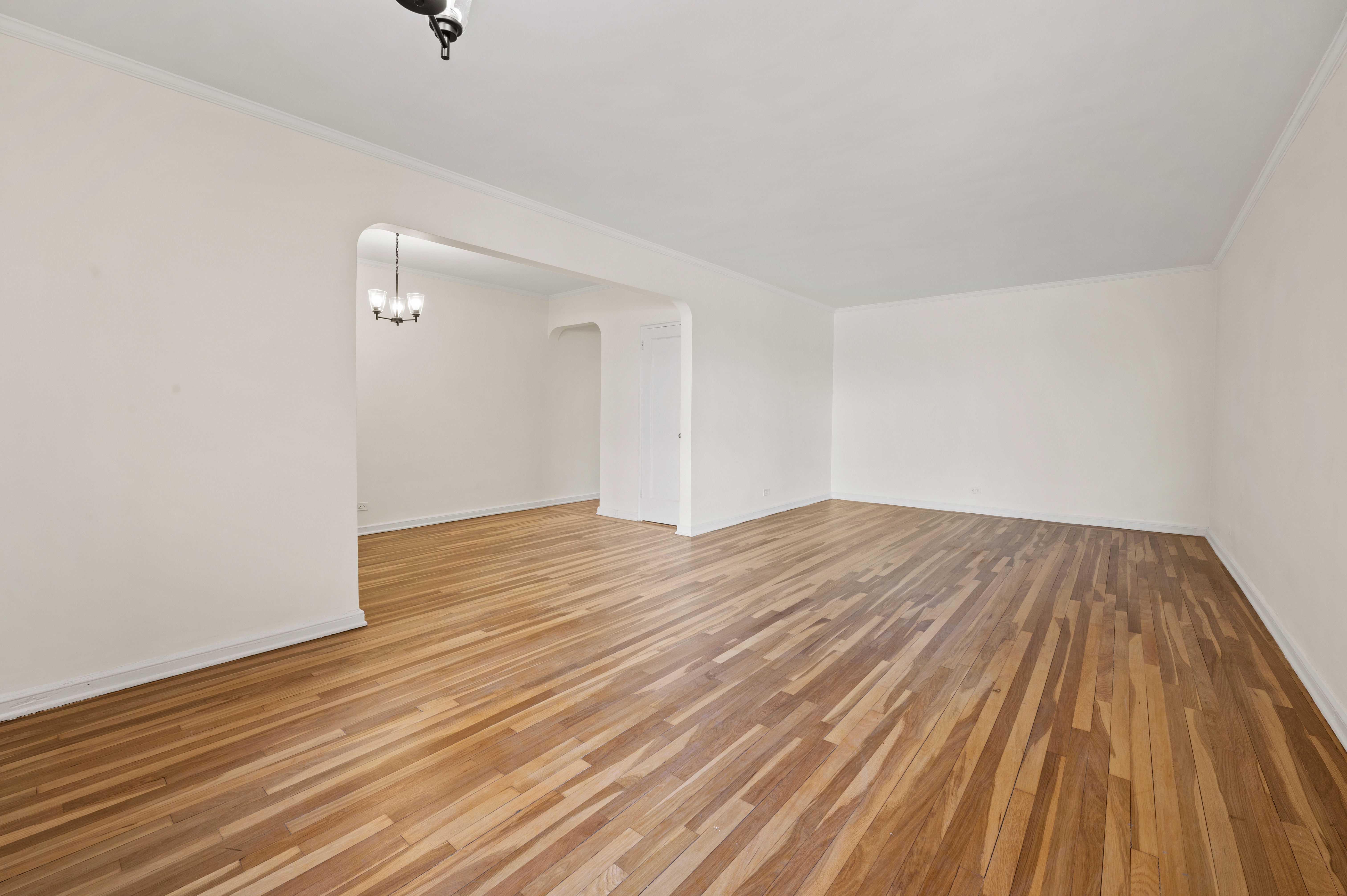 159-34 Riverside Drive West, Unit 3D Manhattan, NY 10032 - Photo 6 of 12 a view of empty room with wooden floor