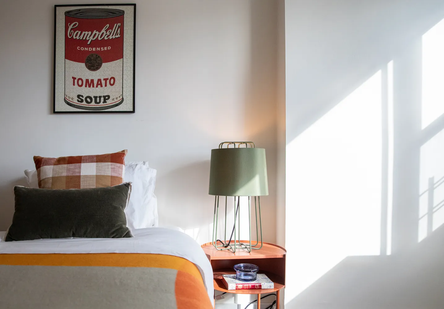 a living room with furniture and a lamp