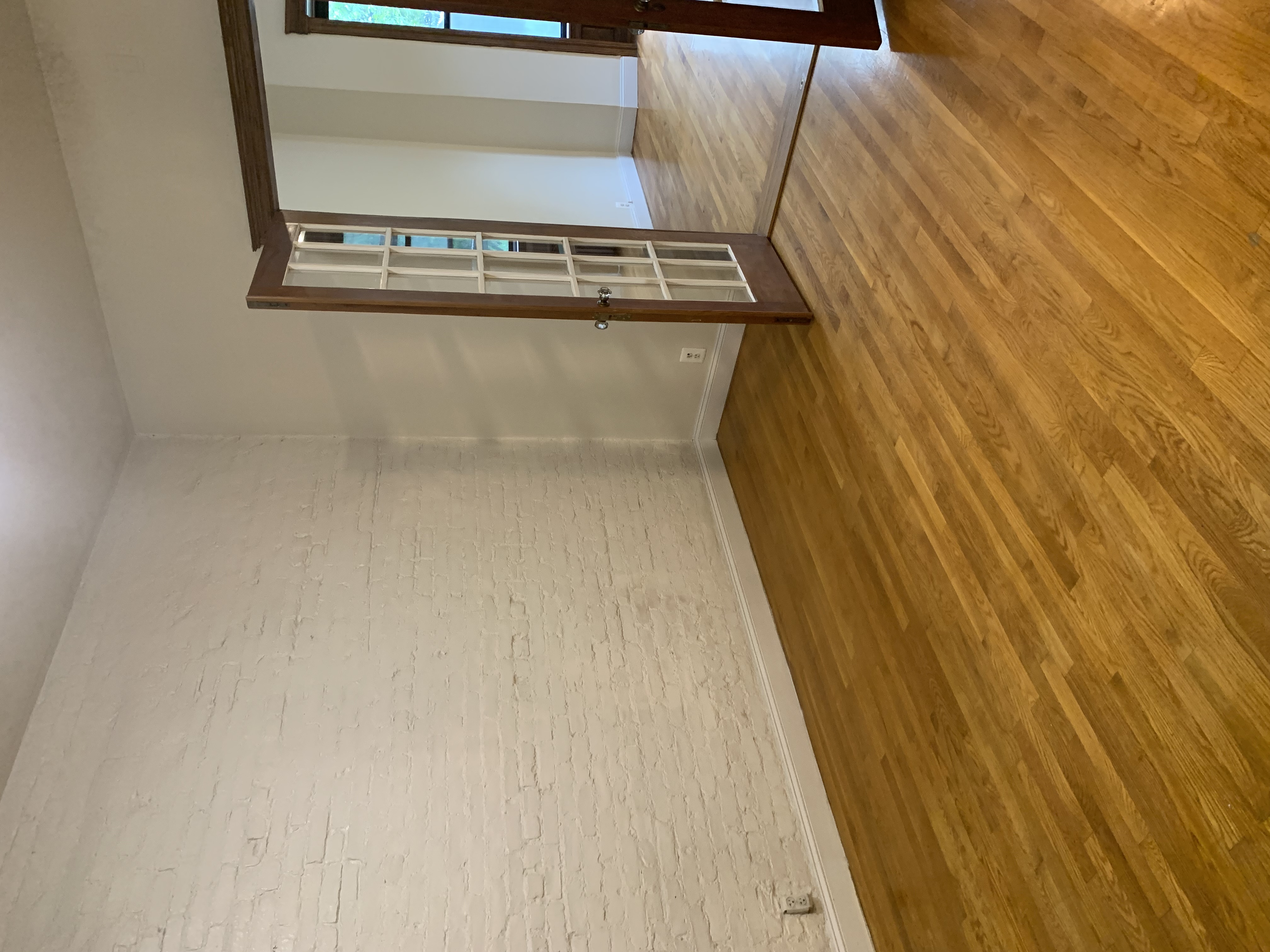 538 44th Street, Unit 2 Brooklyn, NY 11220 - Photo 6 of 6 a view of empty room with wooden floor and fan