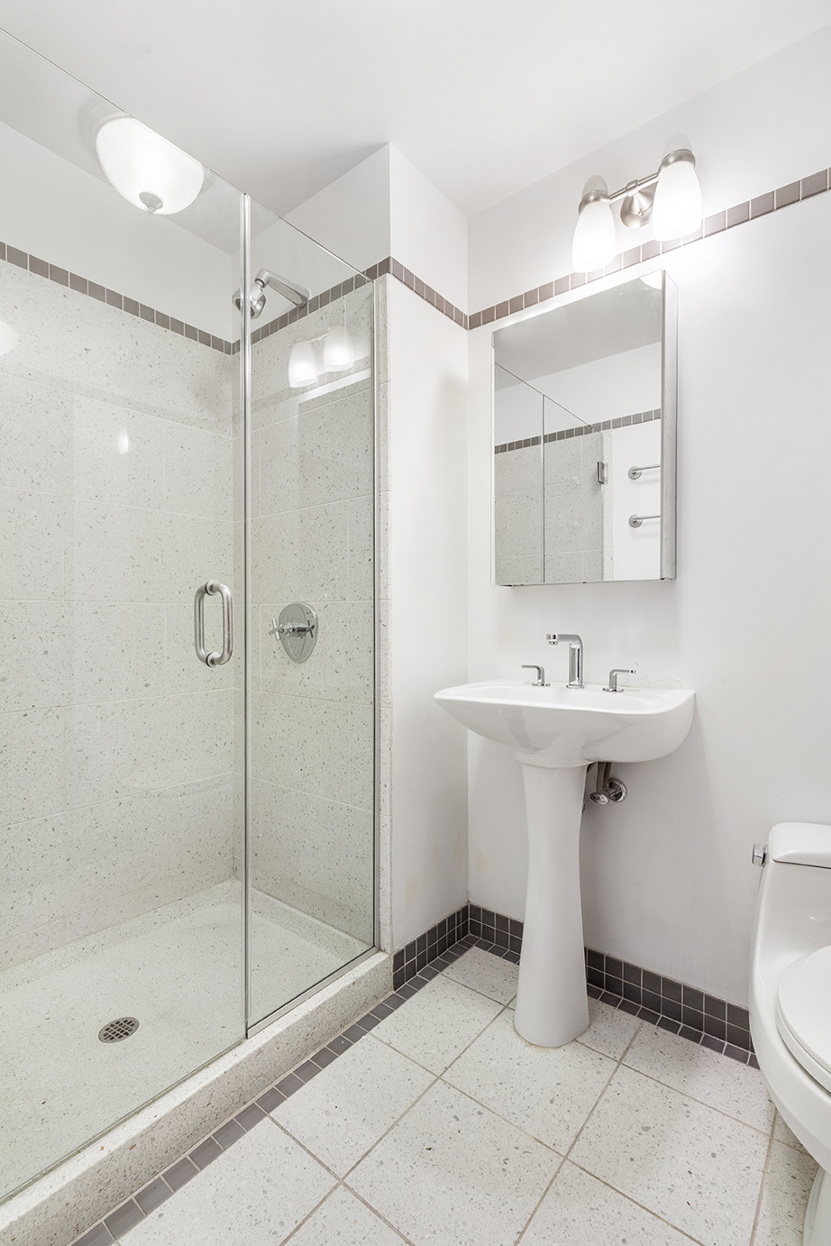 145 Park Place, Unit 3F Brooklyn, NY 11217 - Photo 7 of 9 a bathroom with a sink toilet and shower