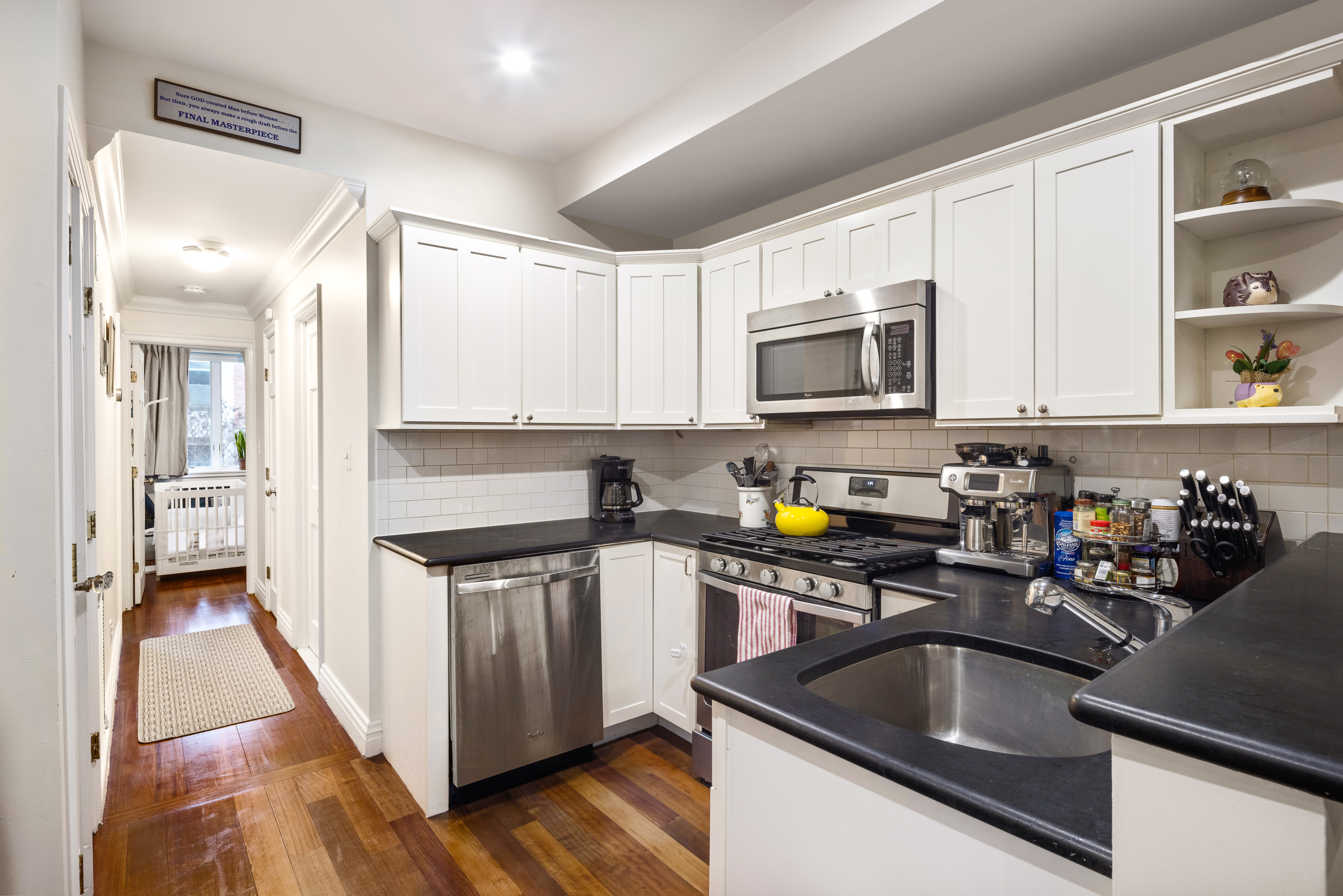 303 Warren Street, Unit 2 Brooklyn, NY 11201 - Photo 4 of 10 a kitchen with stainless steel appliances granite countertop a sink stove and cabinets