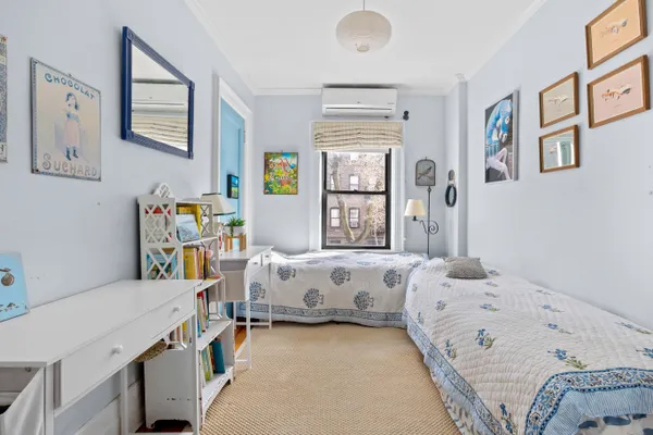 a bed room with a bed and a couch