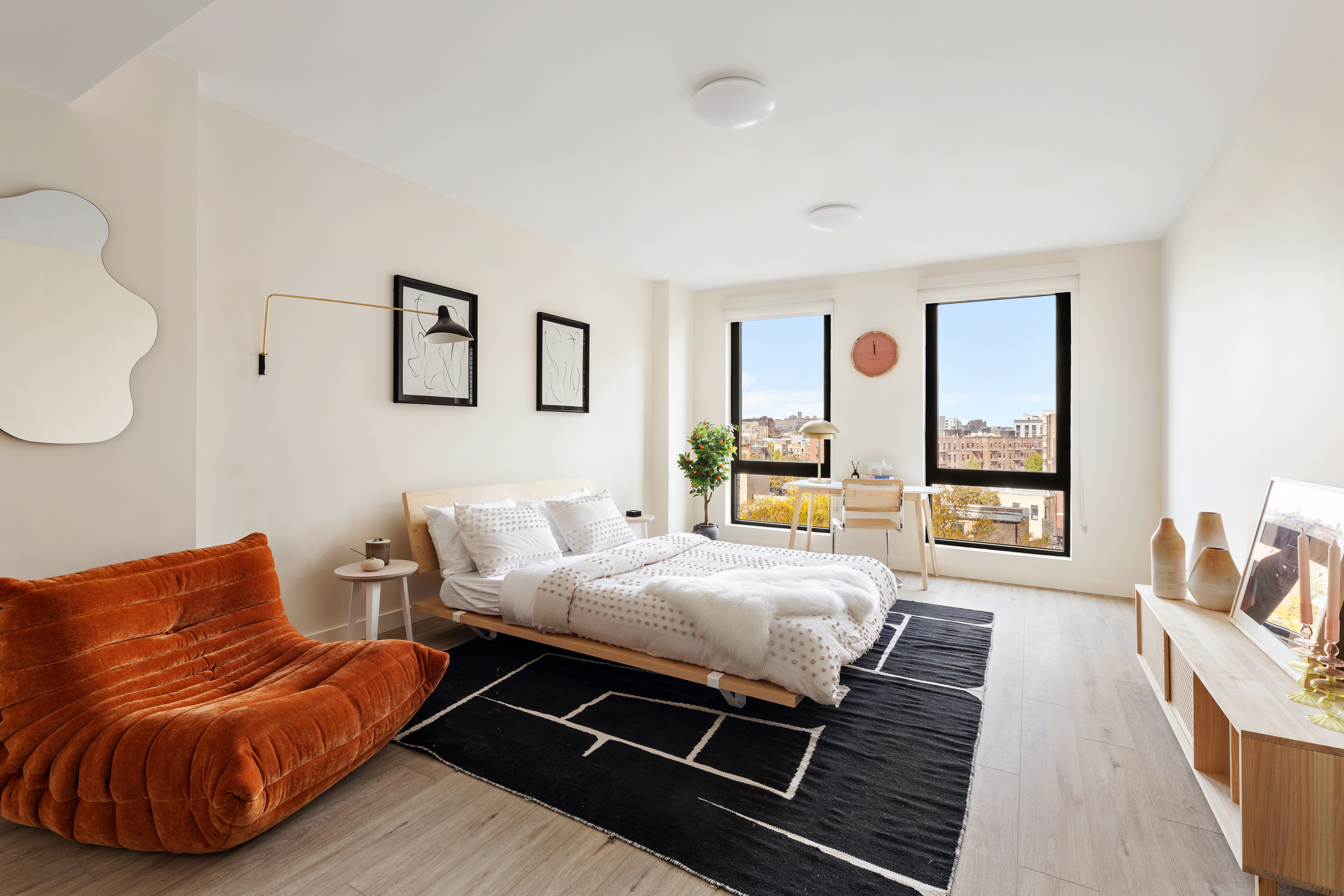 a bedroom with furniture and a window