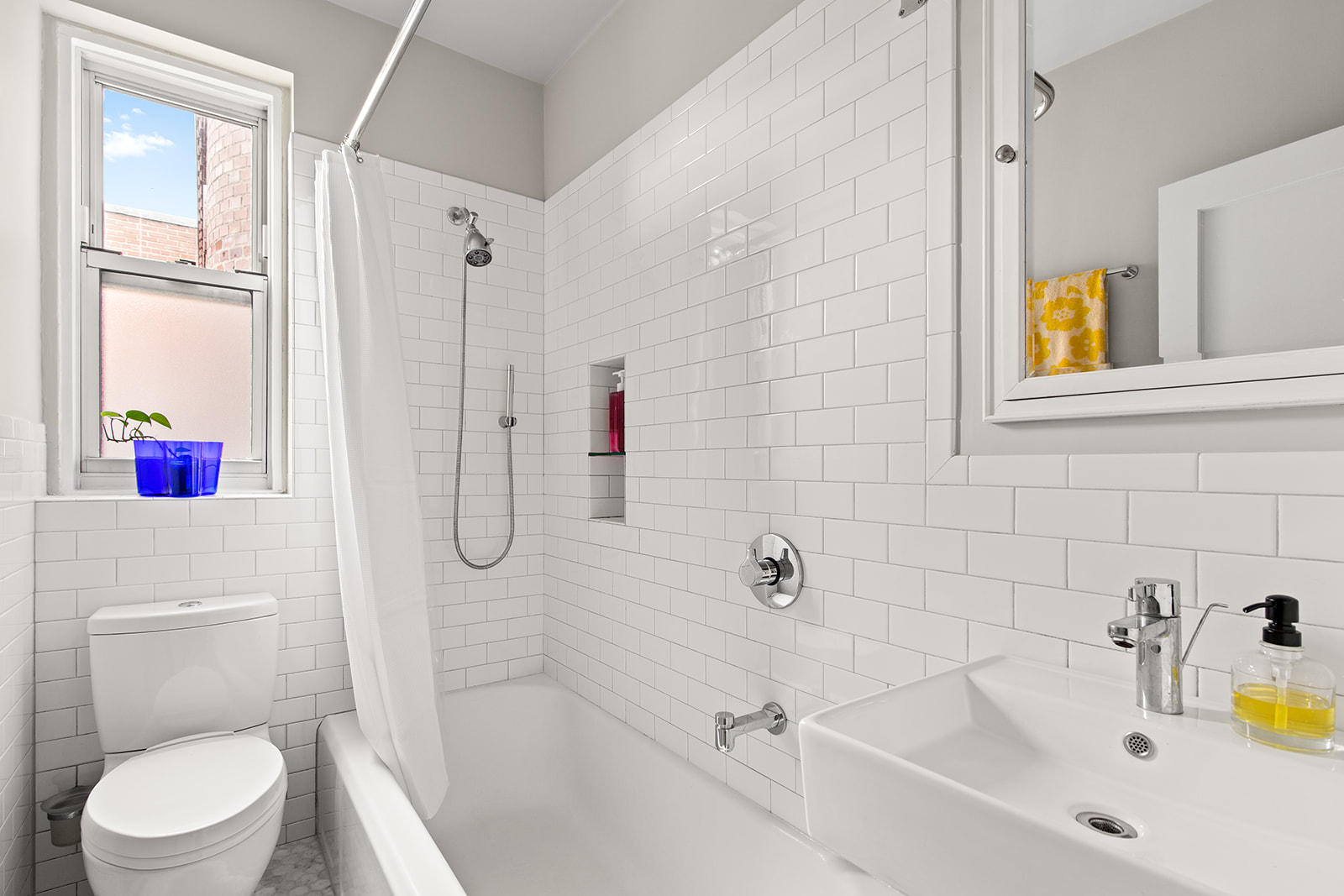 360 Clinton Avenue, Unit 6J Brooklyn, NY 11238 - Photo 6 of 10 a bathroom with a sink and a shower
