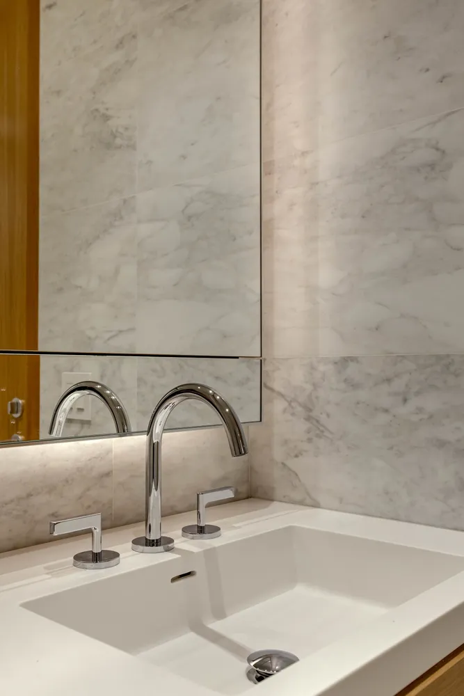 a bathroom with a sink and mirror