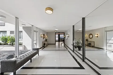 a view of a living room and entryway