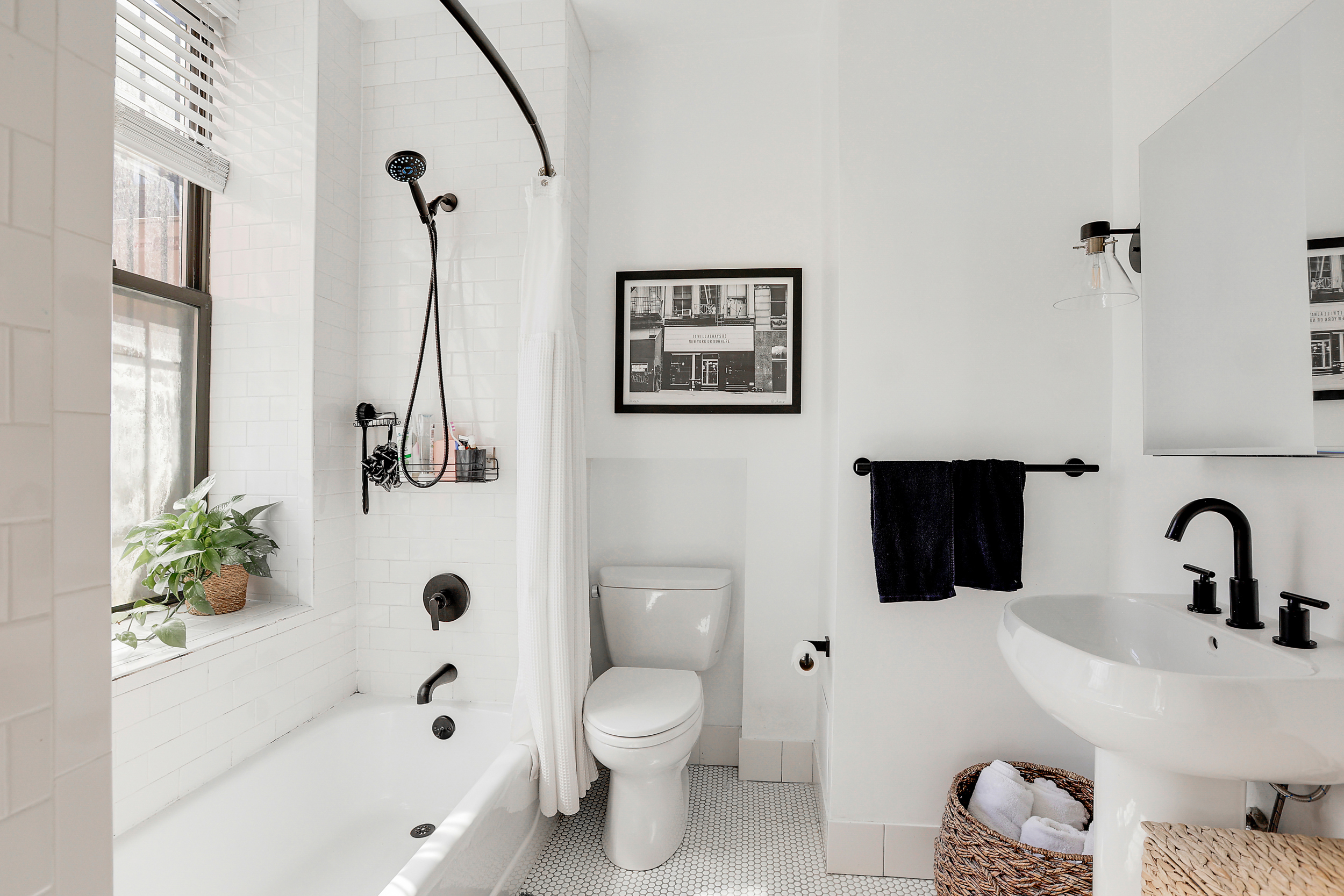 5 Great Jones Street Manhattan, NY 10012 - Photo 8 of 11 a bathroom with a sink a toilet and a bathtub