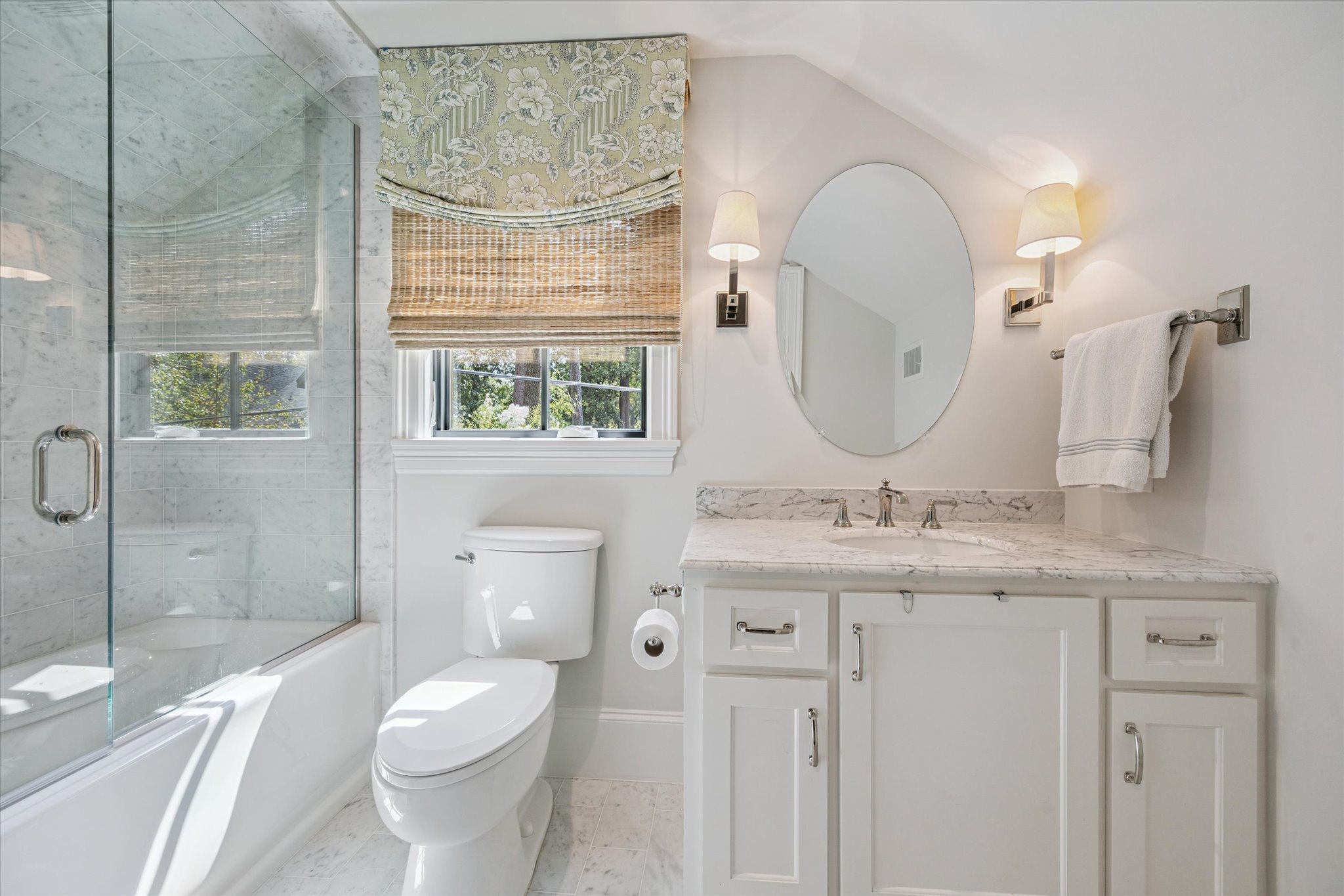 310 Longwoods Lane Houston, TX 77024 - Photo 38 of 49 a bathroom with a granite countertop toilet a sink and a mirror