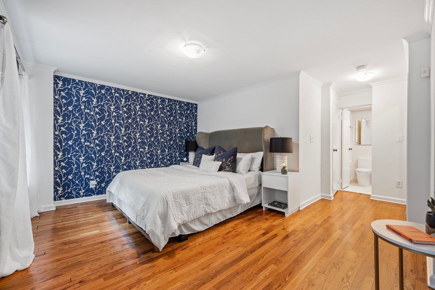 261 West 71st Street, Unit 1 Manhattan, NY 10023 - Photo 8 of 15 a bedroom with a bed and wooden floor