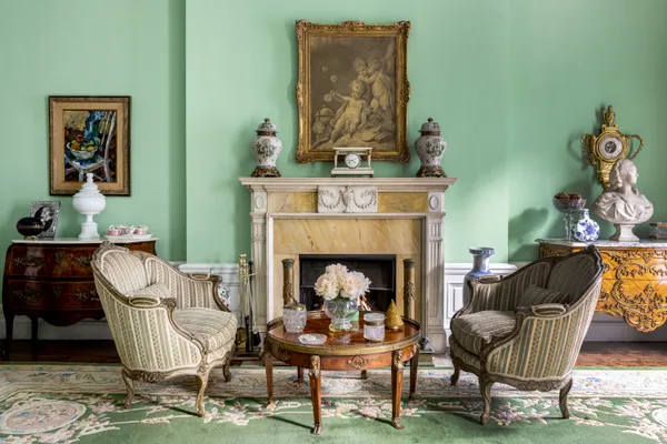 a living room with furniture and a fireplace