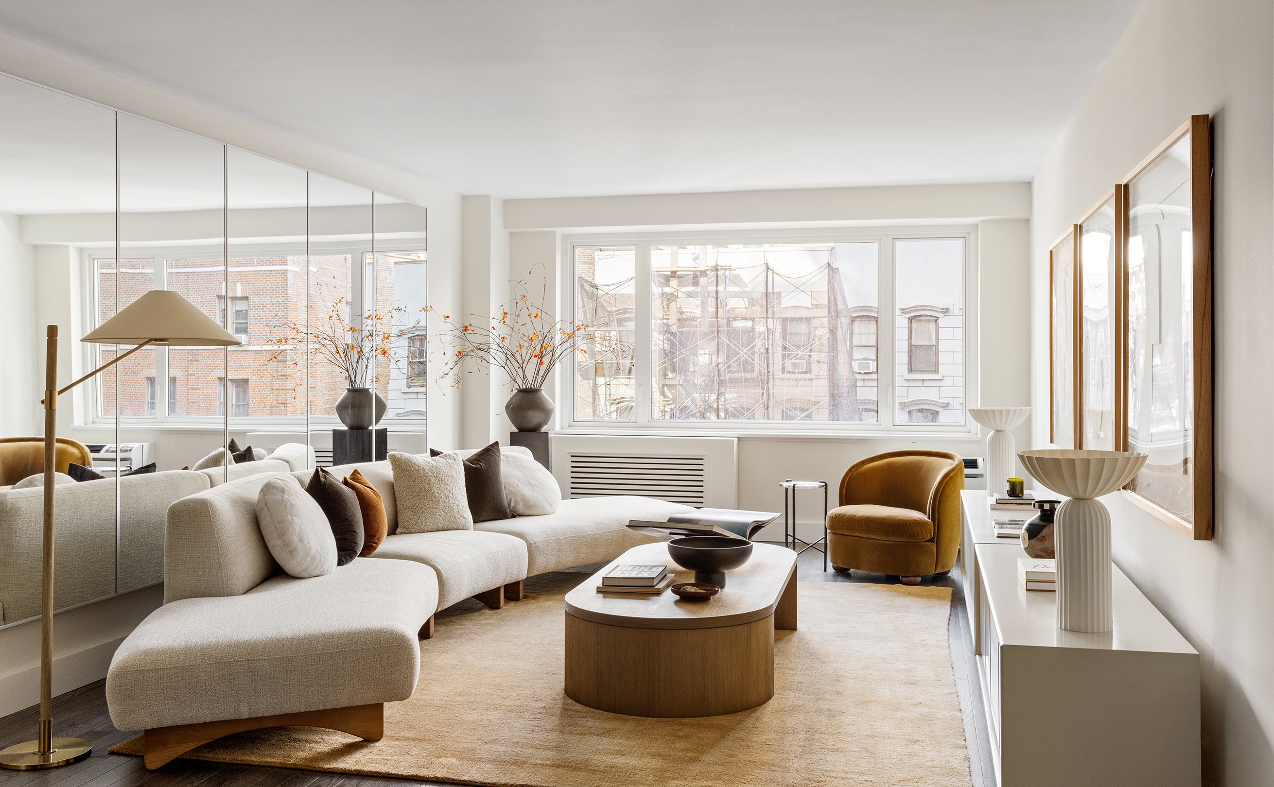 411 East 53rd Street, Unit 6L Manhattan, NY 10022 - Photo 3 of 12 a living room with furniture and a large window