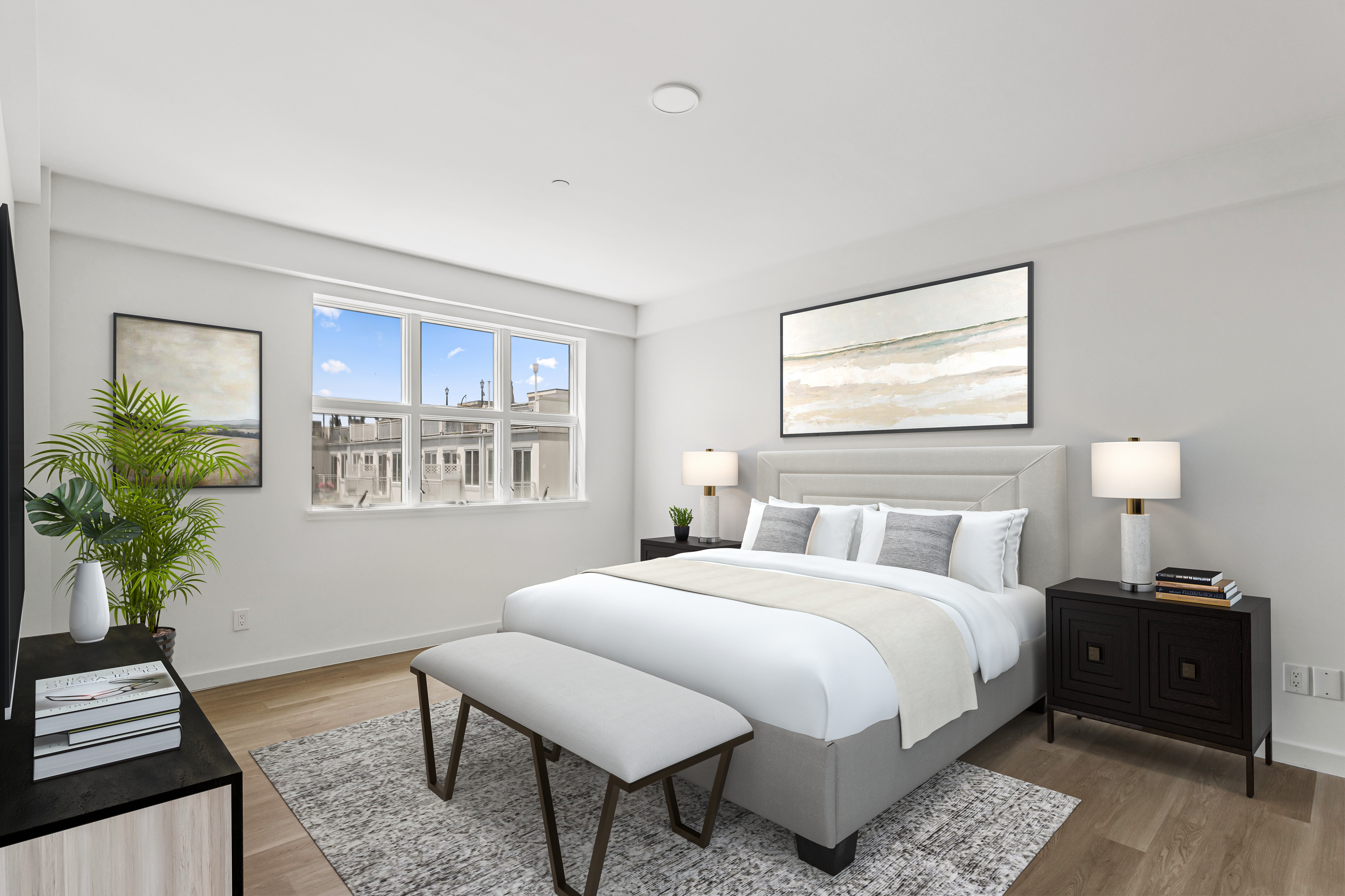 3112 Emmons Avenue, Unit 307 Brooklyn, NY 11235 - Photo 5 of 13 a bedroom with a bed and a potted plant on the dresser