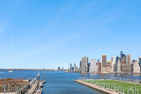 a view of a city with tall buildings in the background