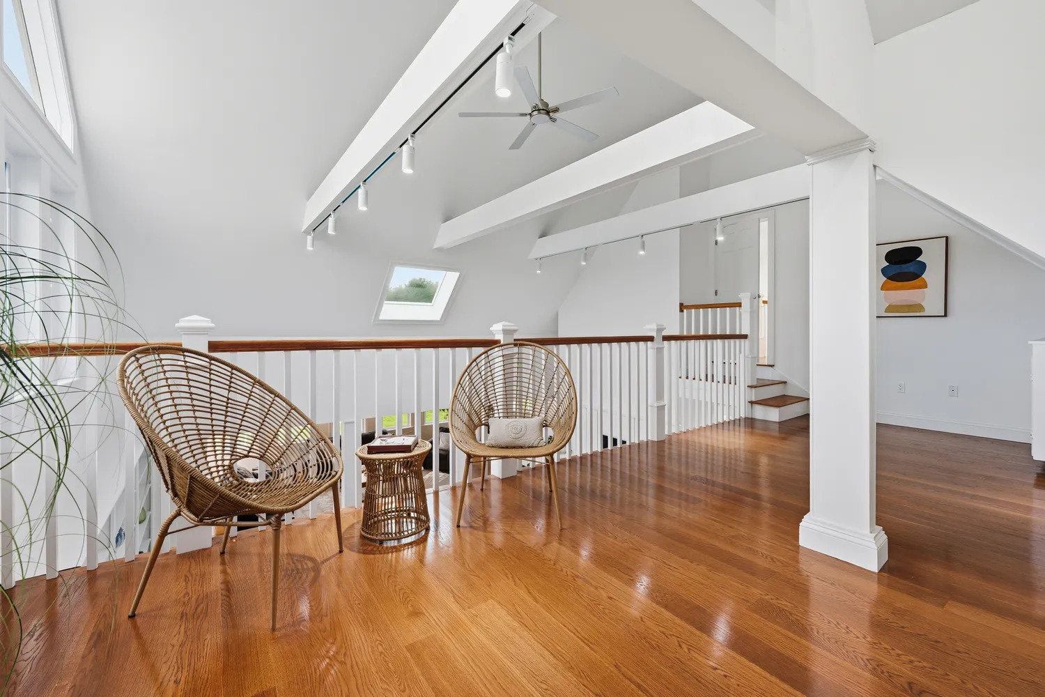 a view of a dining room with furniture large windows and wooden floor