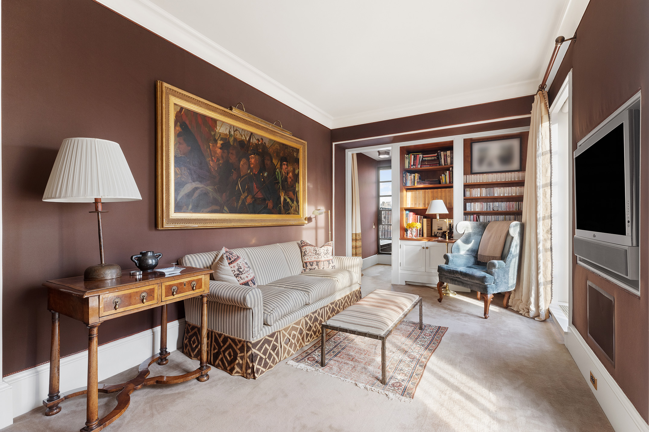 953 5th Avenue, Unit PH Manhattan, NY 10075 - Photo 22 of 27 a living room with furniture a flat screen tv and a window