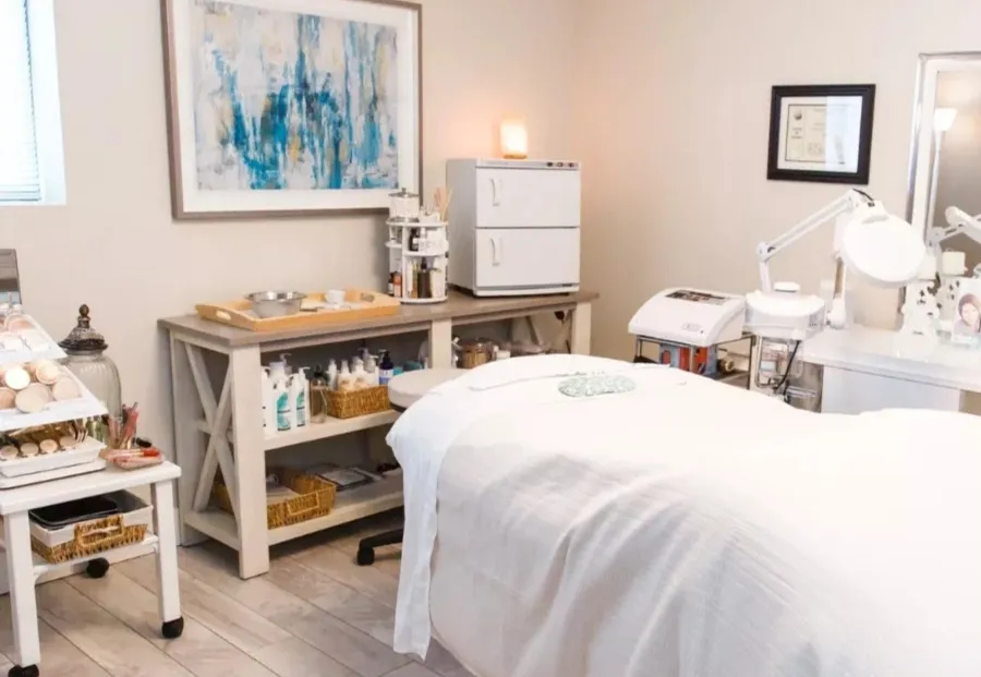 a bed room with a bed and a chair