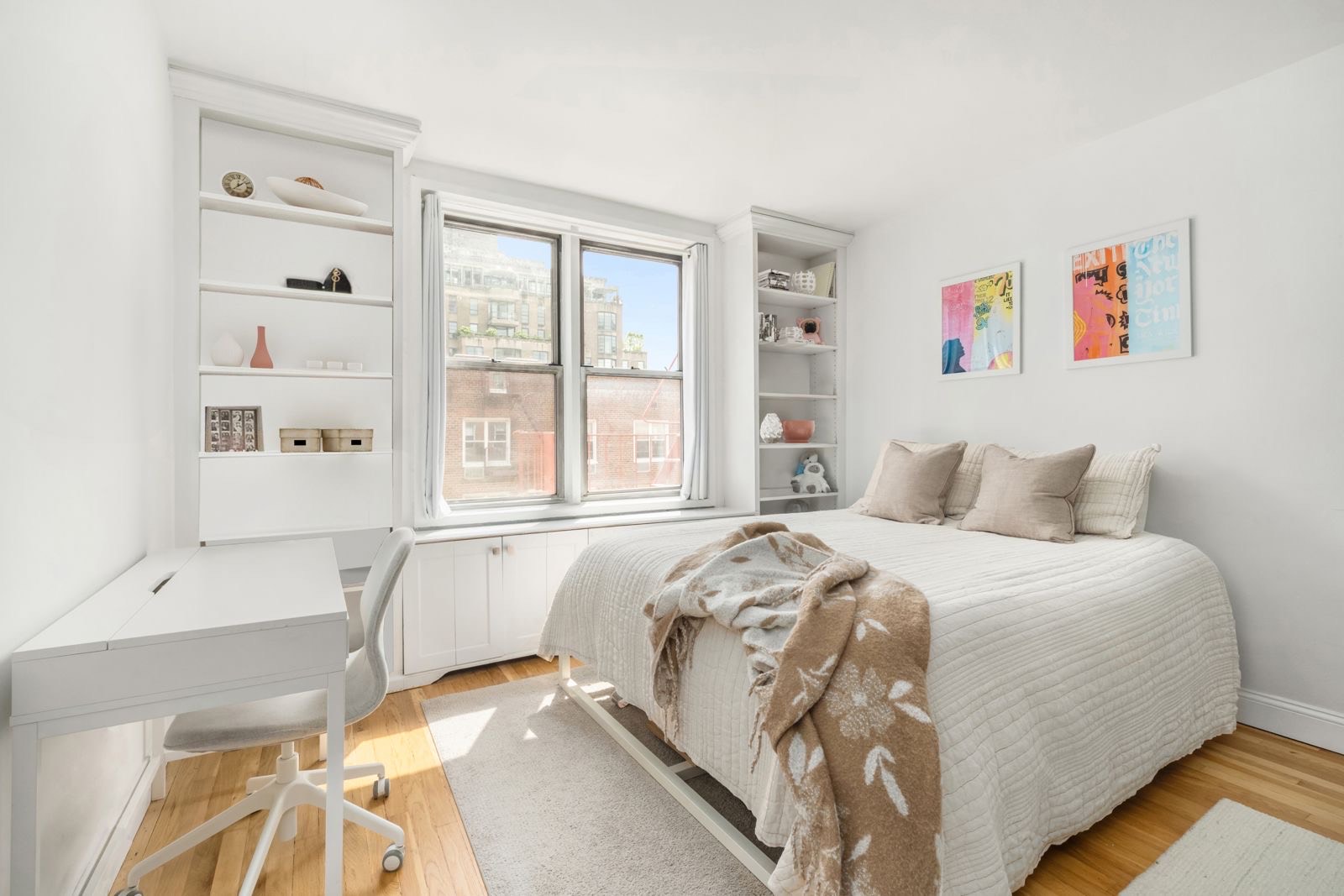 25 West 13th Street, Unit 6ON Manhattan, NY 10011 - Photo 3 of 7 a bedroom with a bed and a large window