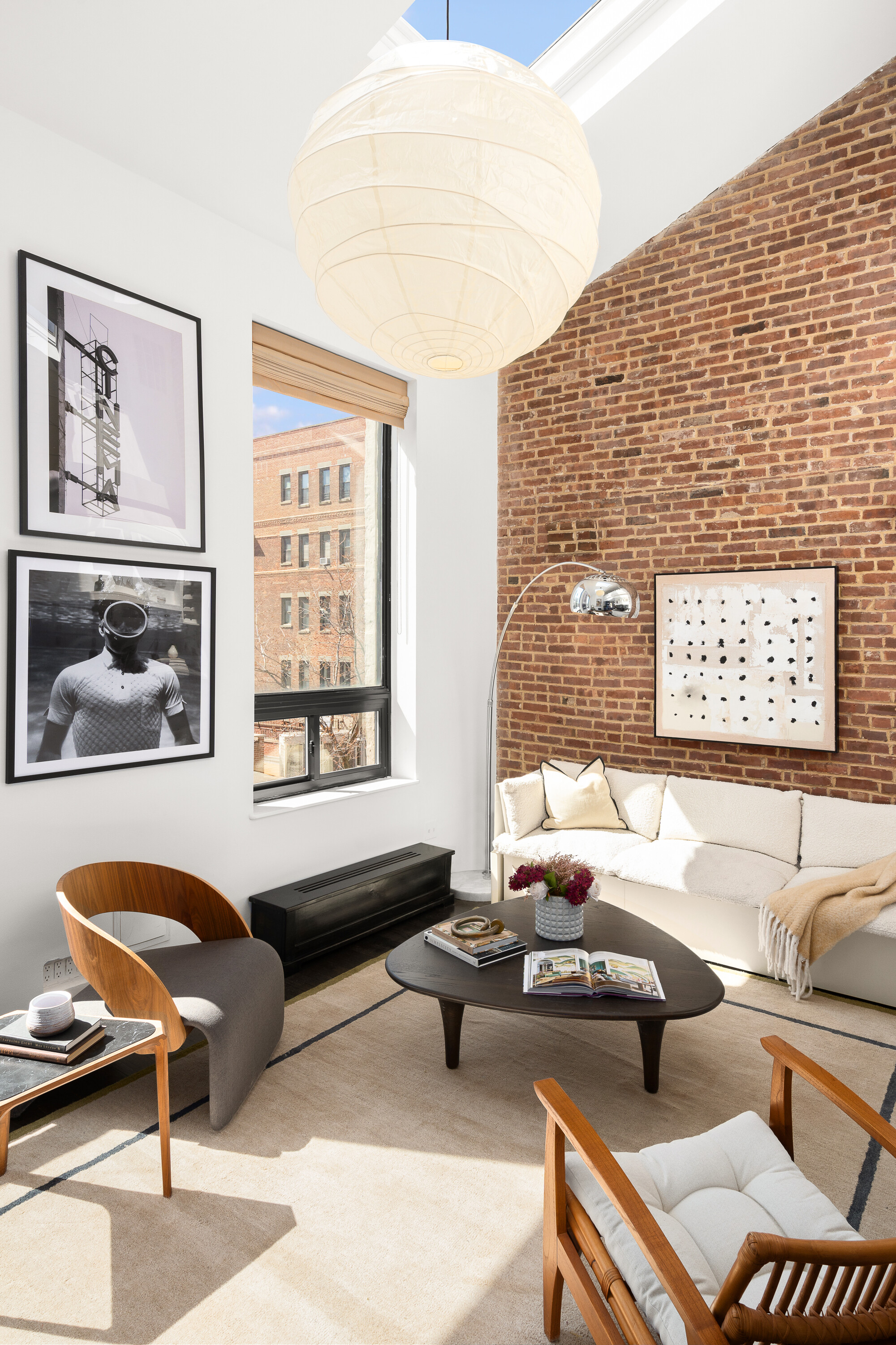 342 West 85th Street, Unit PH6AB Manhattan, NY 10024 - Photo 3 of 17 a living room with furniture and a window